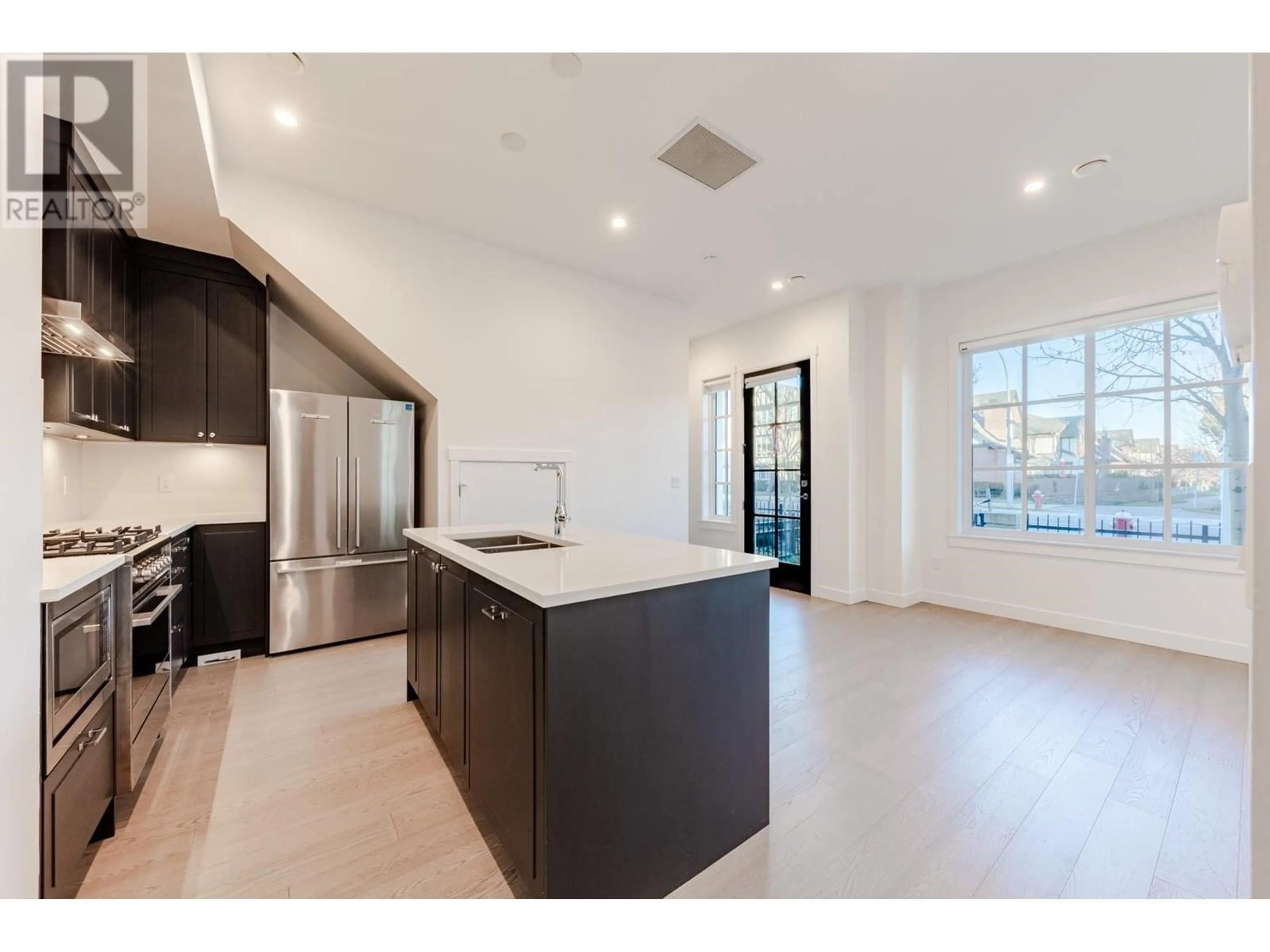 Open concept kitchen, ceramic/tile floor for 1 - 10495 NO. 2 ROAD, Richmond British Columbia V7E2E5