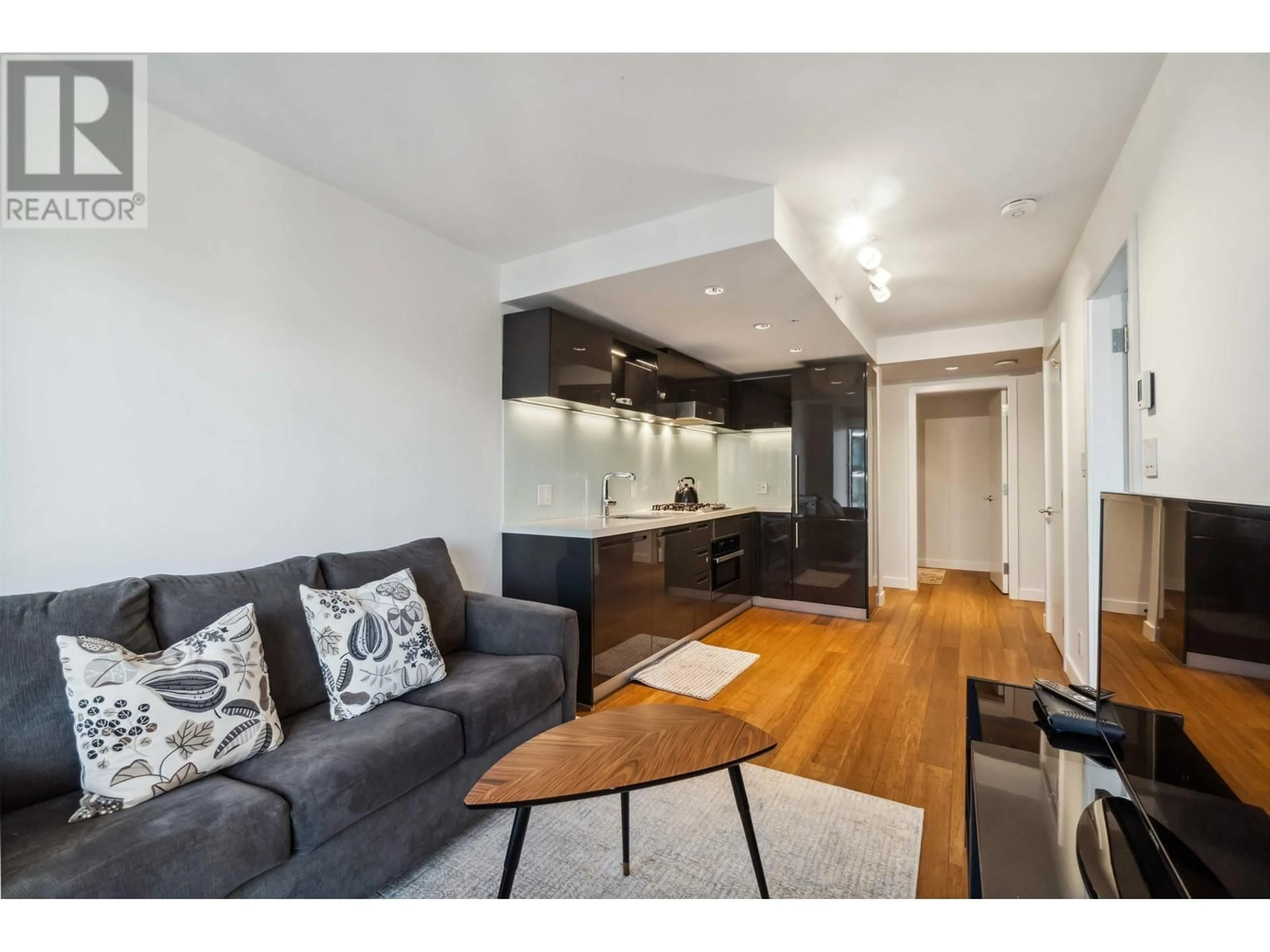 Living room with furniture, wood/laminate floor for 2807 - 777 RICHARDS STREET, Vancouver British Columbia V6B0M6