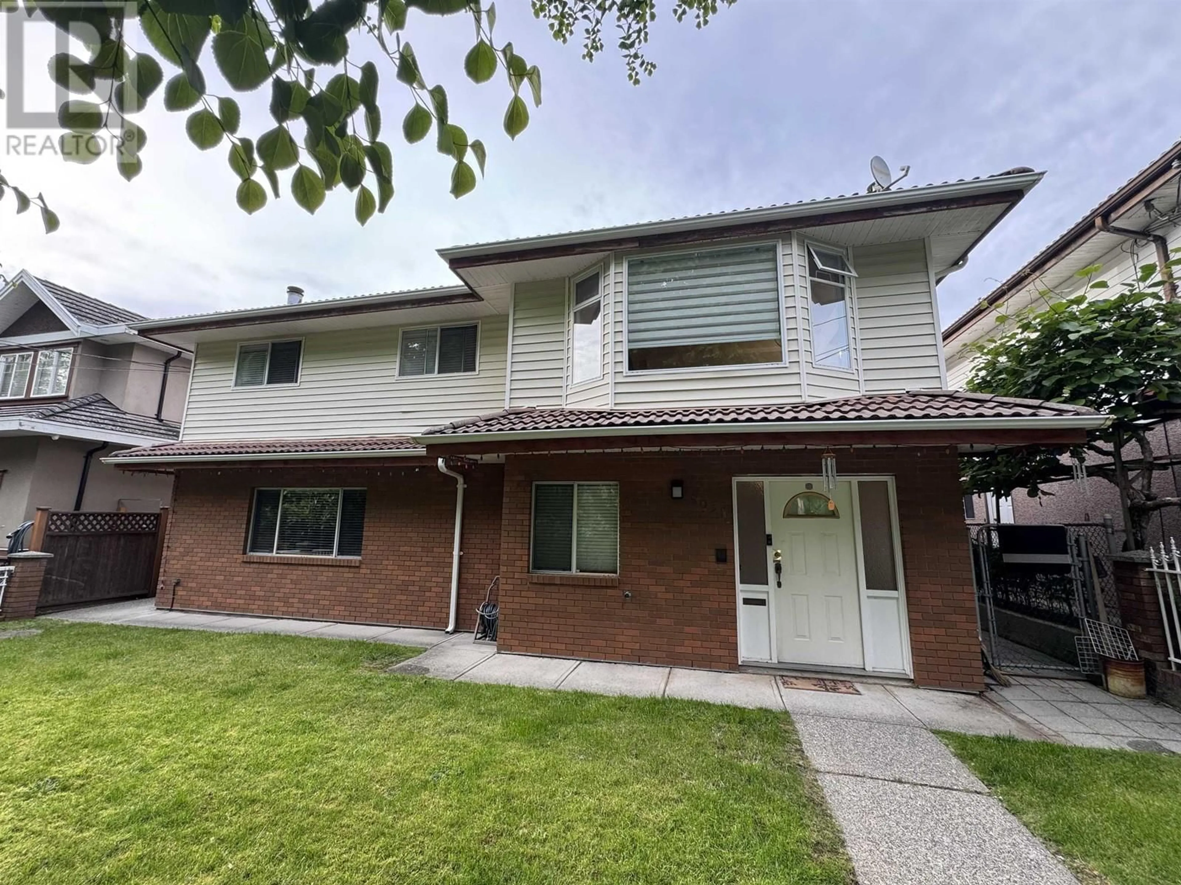 Home with vinyl exterior material, street for 5031 HALIFAX STREET, Burnaby British Columbia V5B2N4