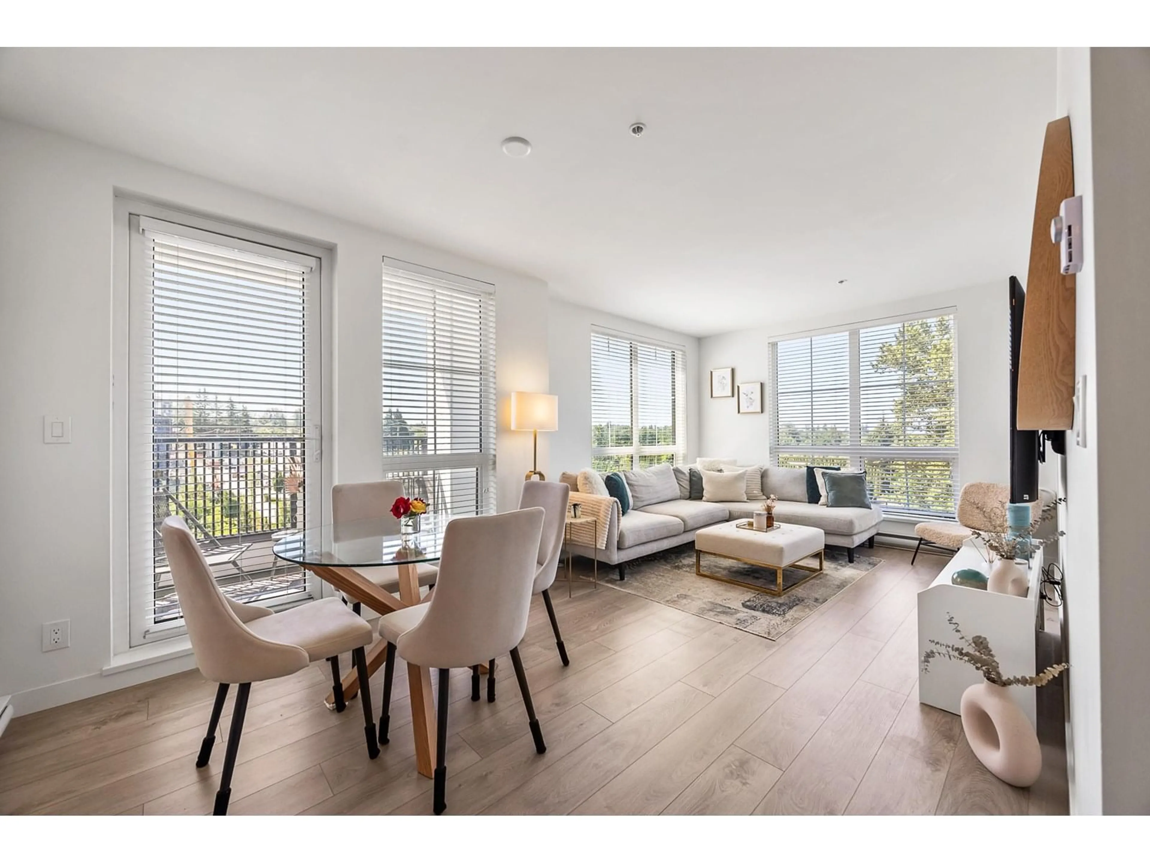 Living room with furniture, wood/laminate floor for A410 - 20018 83A, Langley British Columbia V2Y3P2