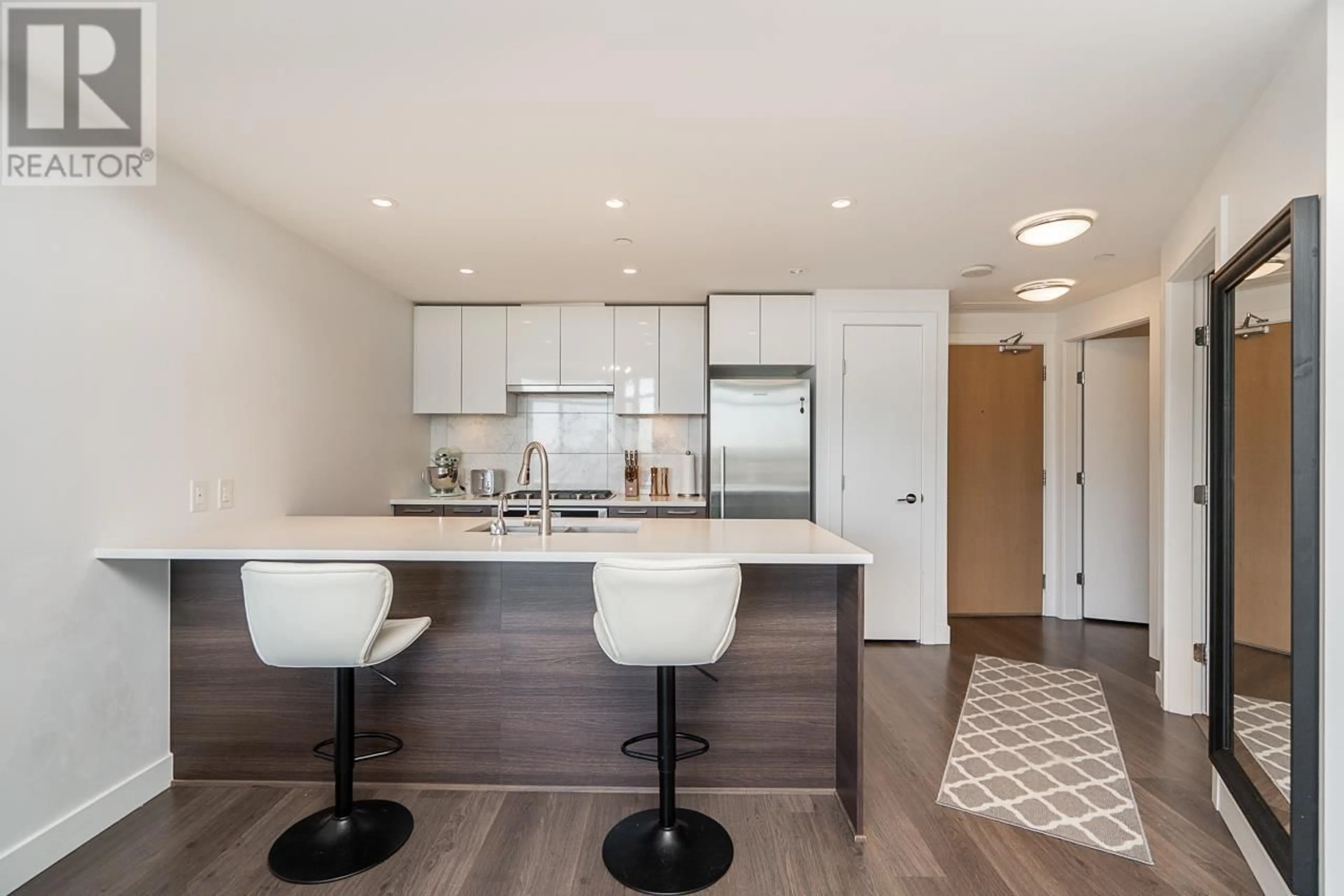 Open concept kitchen, wood/laminate floor for 1011 - 3557 SAWMILL CRESCENT, Vancouver British Columbia V5S0E2