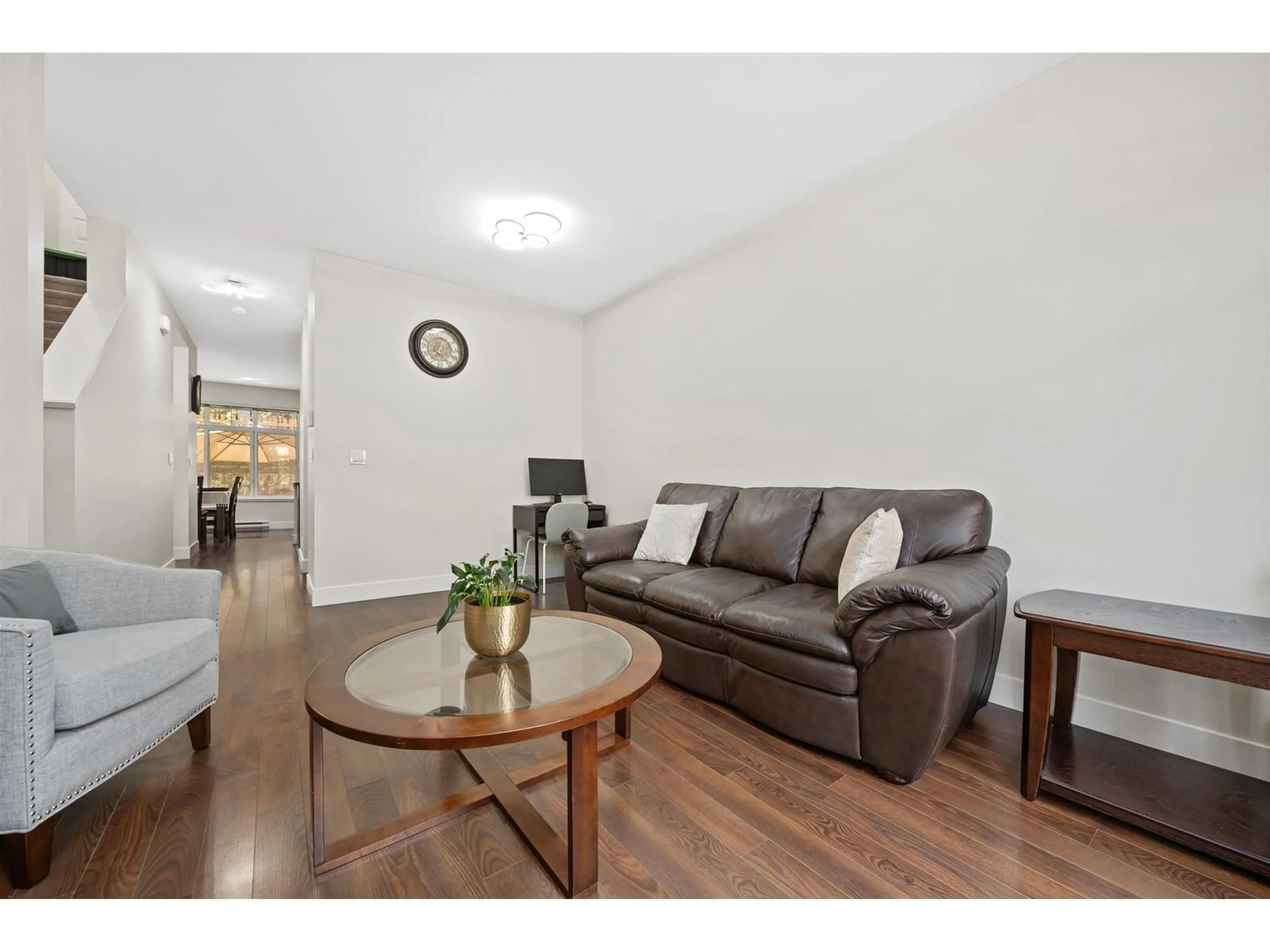 Living room with furniture, wood/laminate floor for 35 - 6299 144, Surrey British Columbia V3X1A2