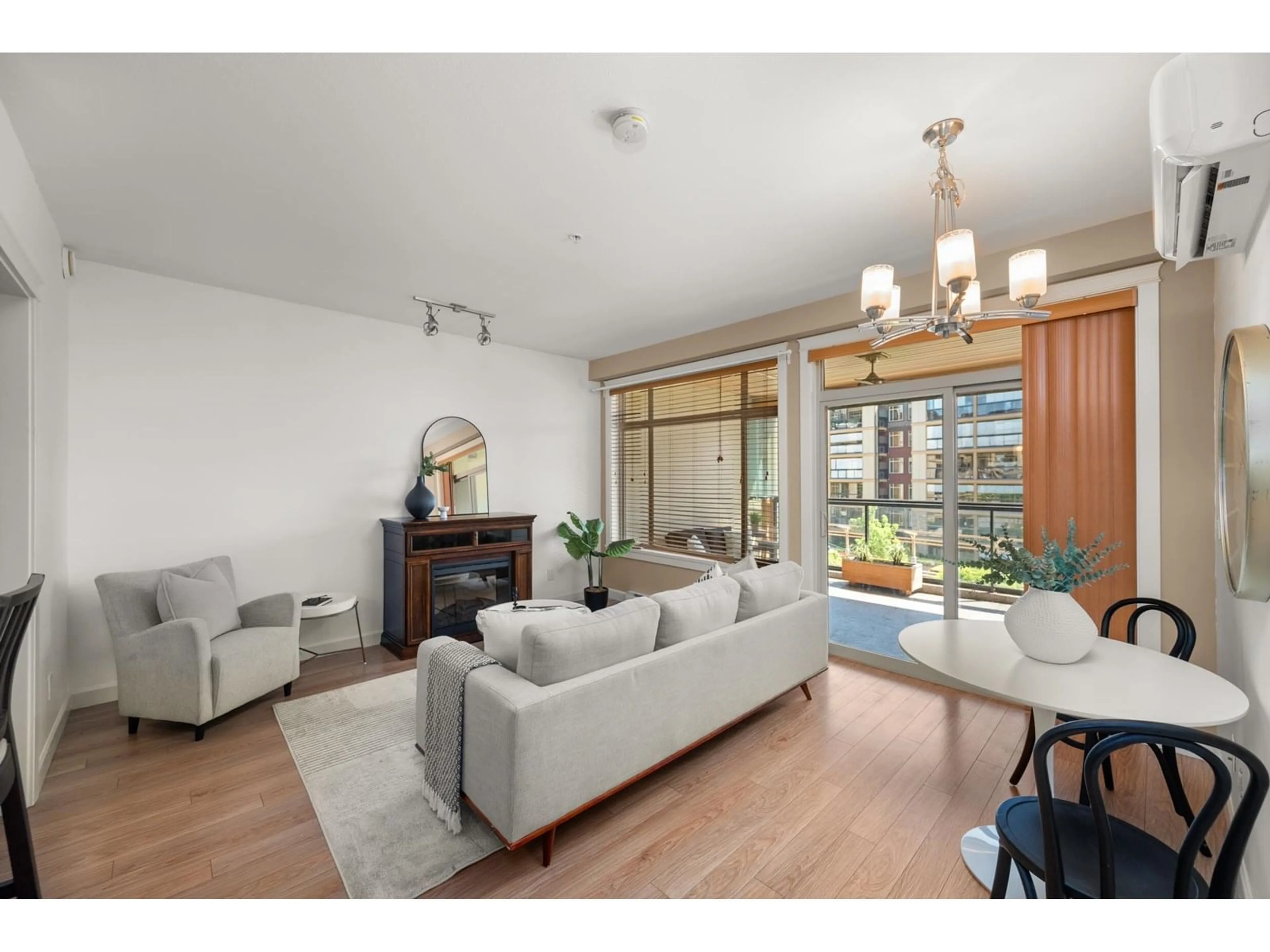 Living room with furniture, wood/laminate floor for 312 - 2860 TRETHEWEY, Abbotsford British Columbia V2T0G5