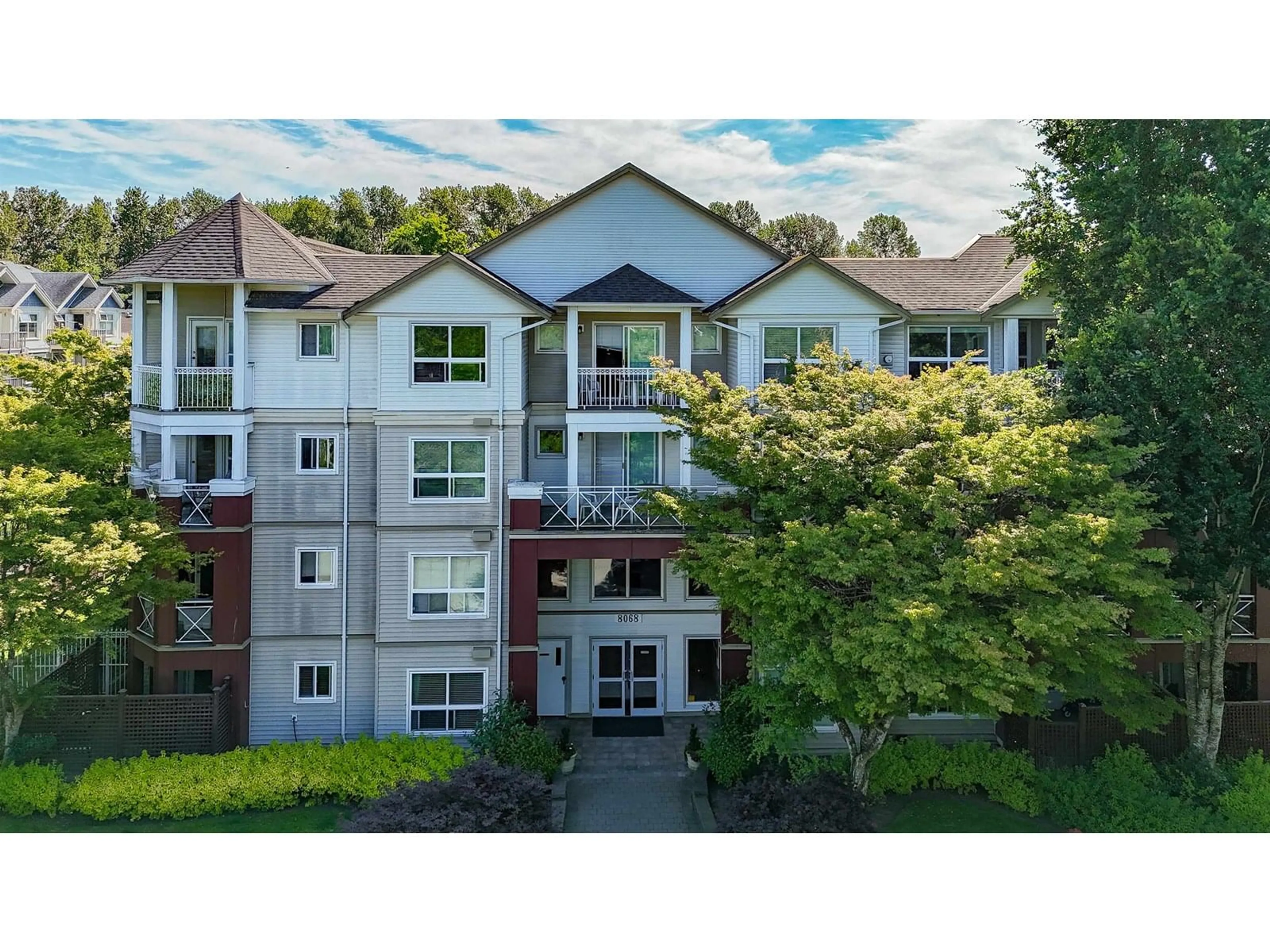 A pic from outside/outdoor area/front of a property/back of a property/a pic from drone, mountain view for 215 - 8068 120A, Surrey British Columbia V3W3P3