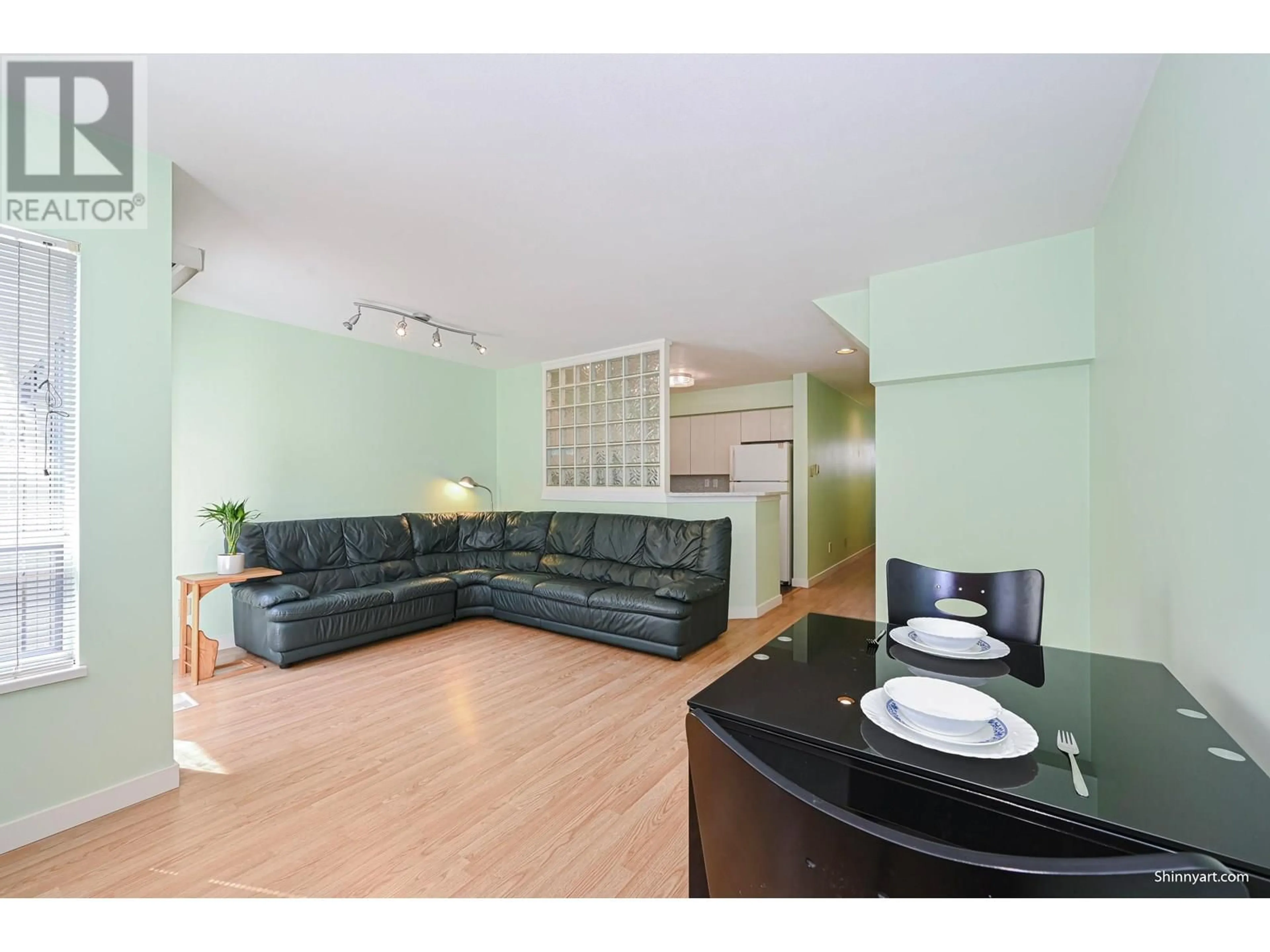 Living room with furniture, wood/laminate floor for 11 - 6391 COONEY ROAD, Richmond British Columbia V6Y2J5