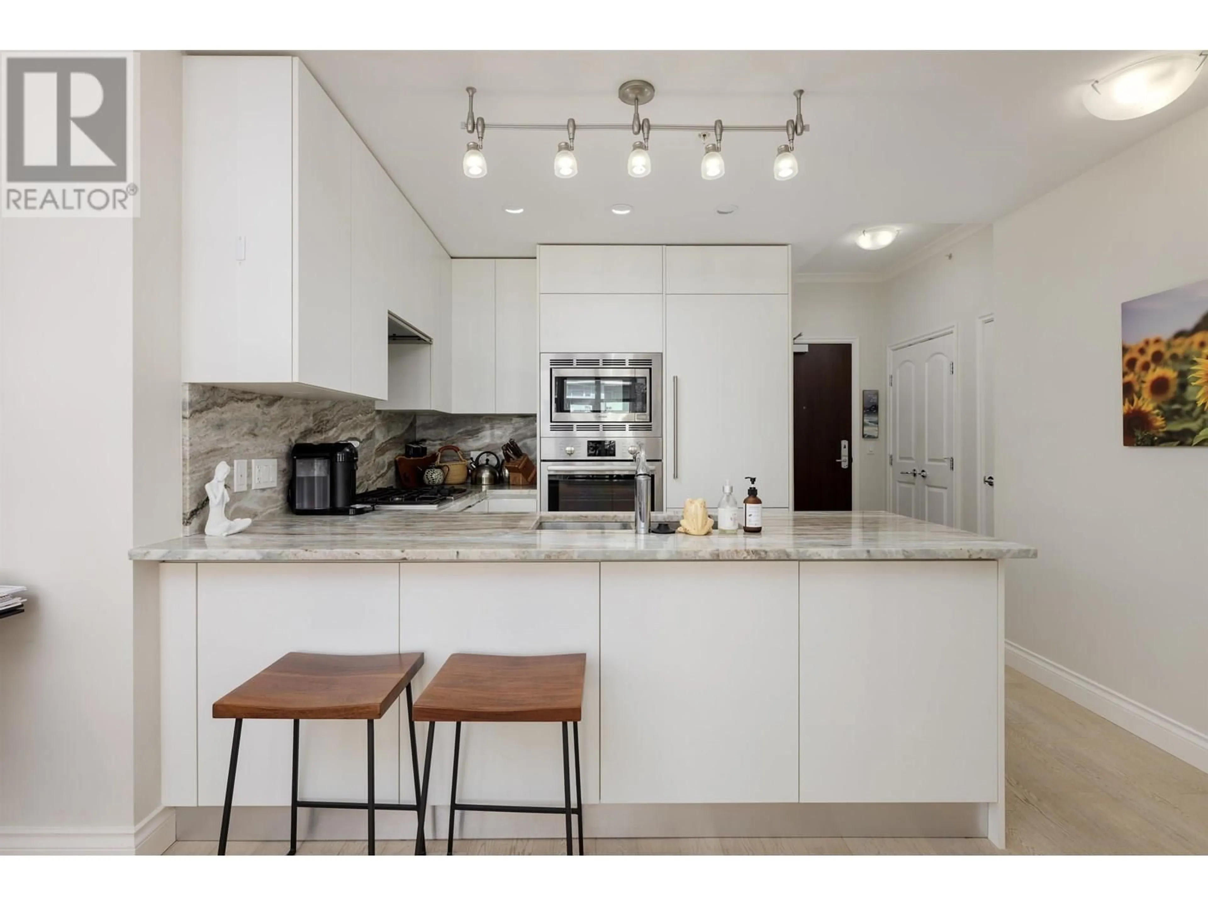 Open concept kitchen, ceramic/tile floor for 708 - 185 VICTORY SHIP WAY, North Vancouver British Columbia V7L0G2