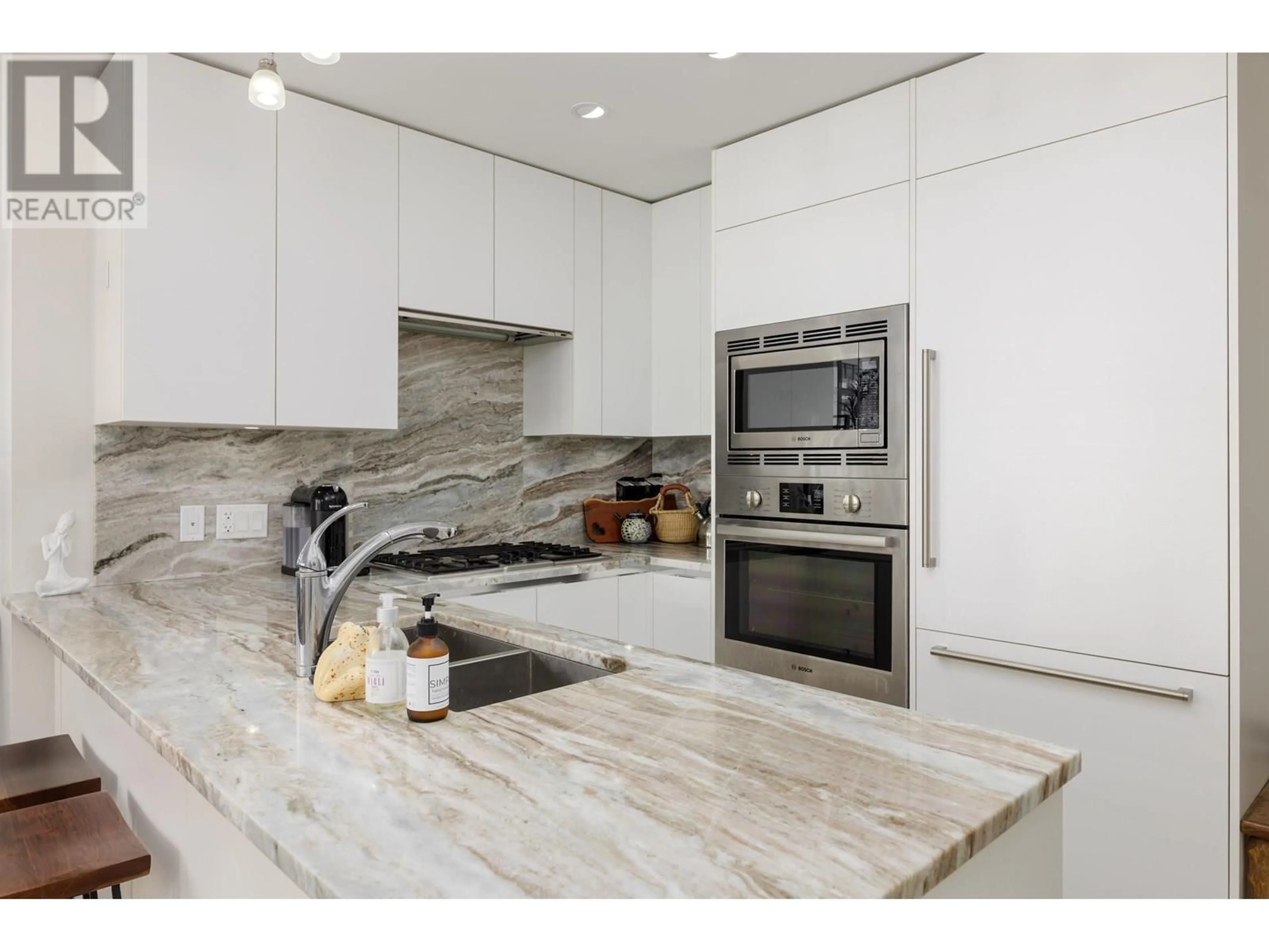 Contemporary kitchen, ceramic/tile floor for 708 - 185 VICTORY SHIP WAY, North Vancouver British Columbia V7L0G2