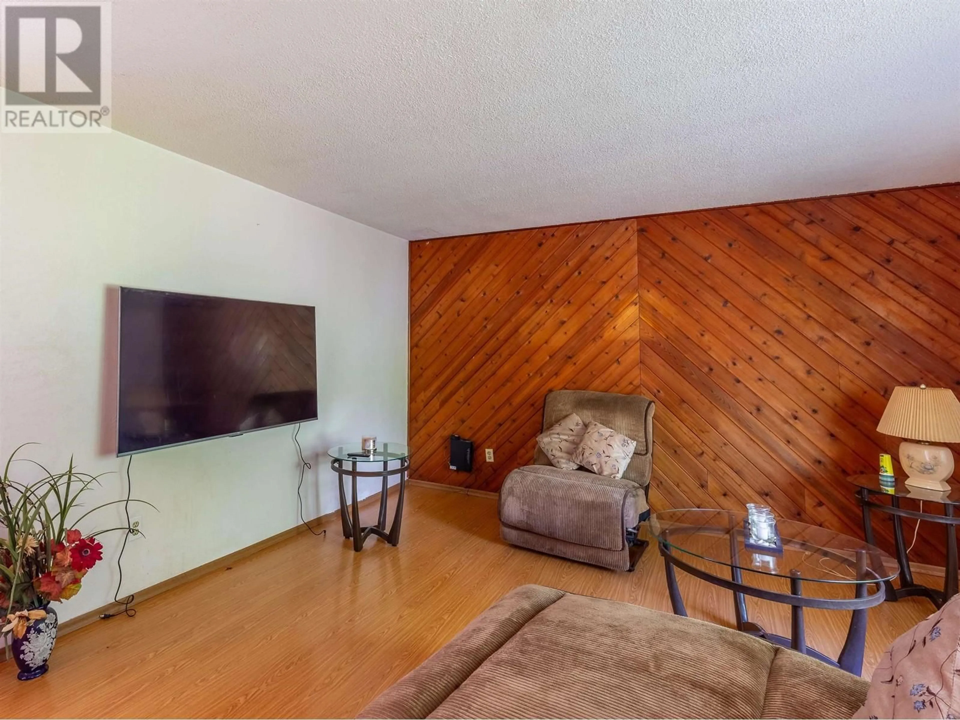 Living room with furniture, wood/laminate floor for 4446 WHALEN ROAD, Smithers British Columbia V0J2N2