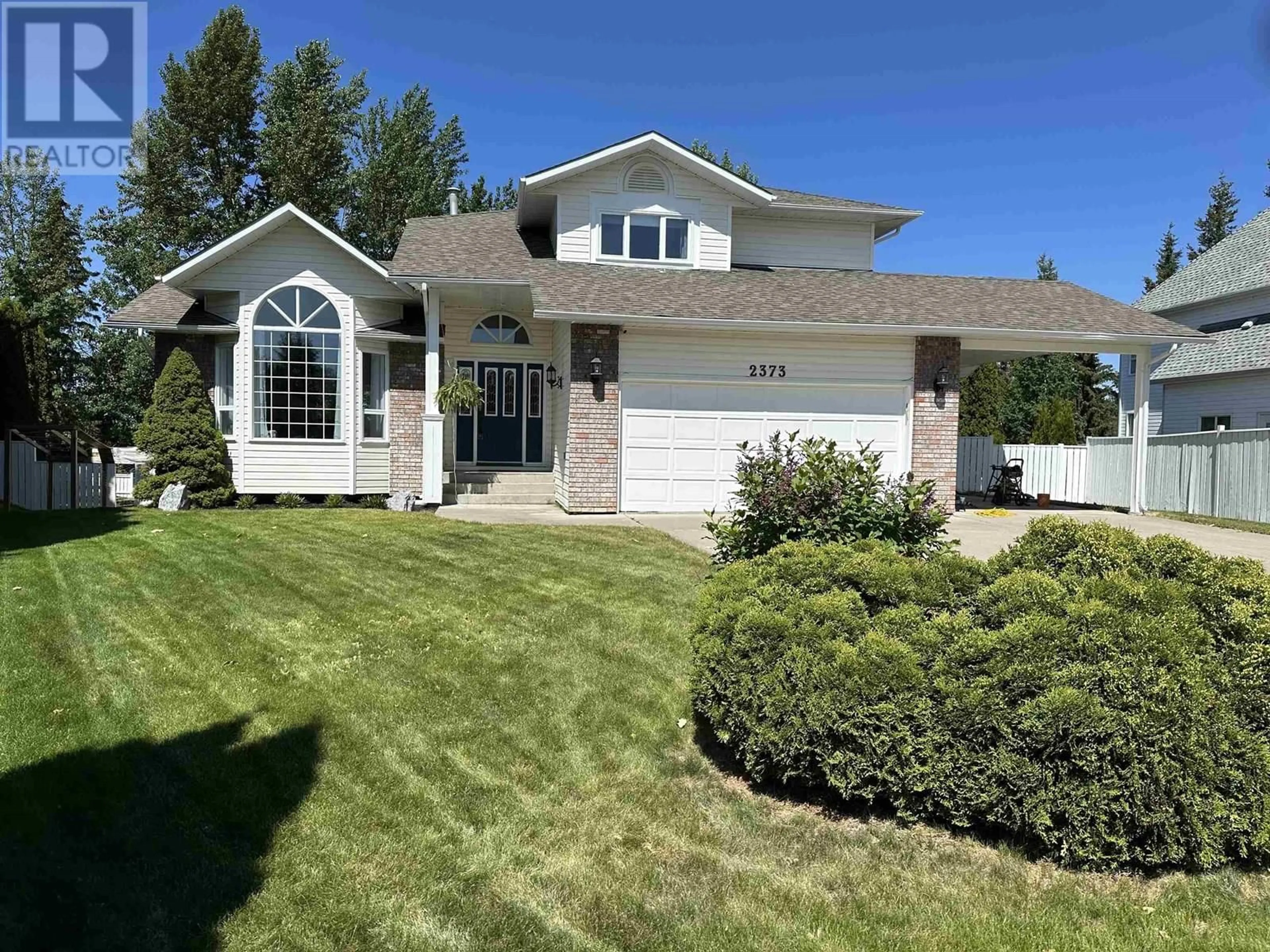 Home with vinyl exterior material, street for 2373 SADLER DRIVE, Prince George British Columbia V2K4N7