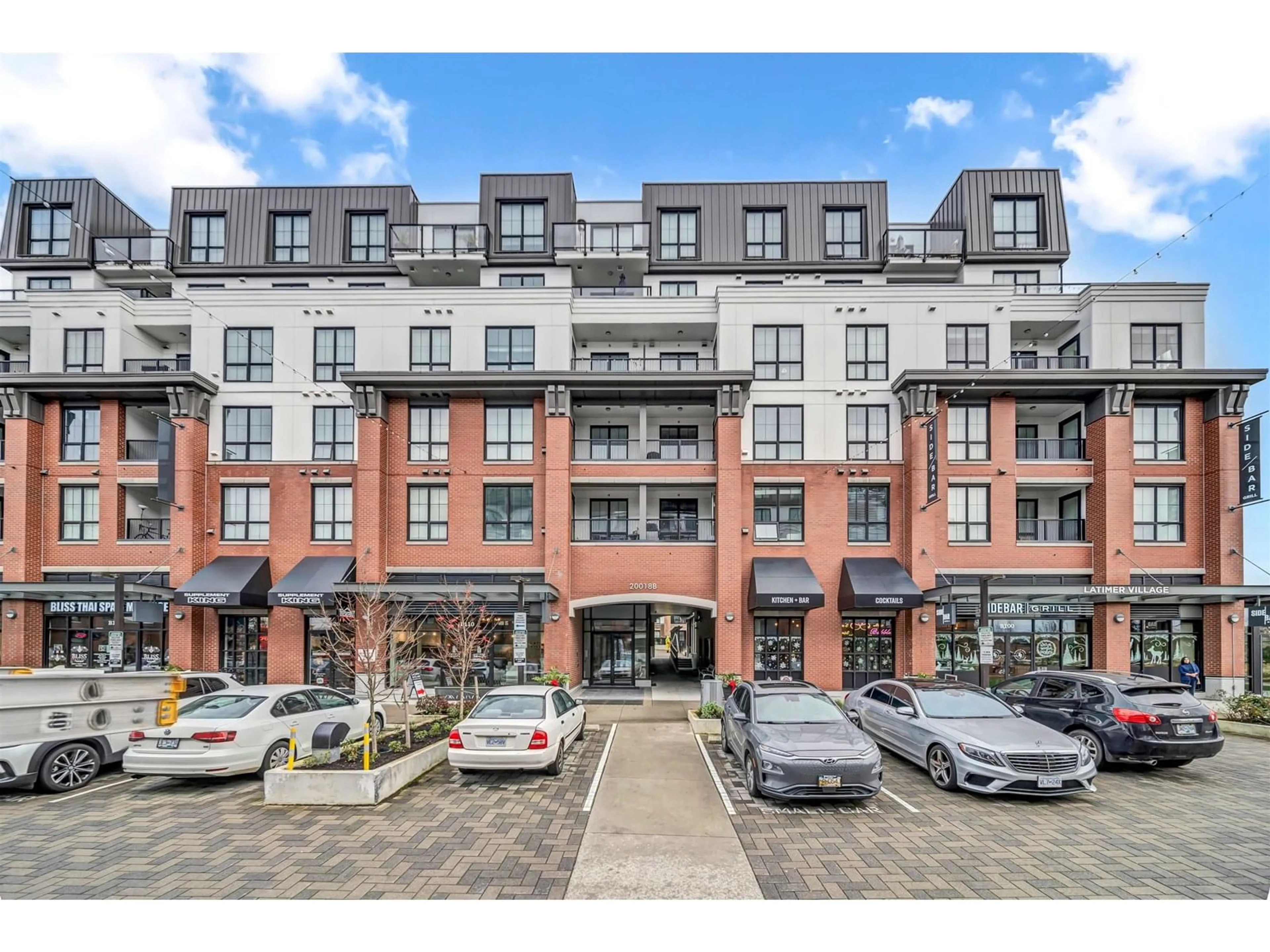 A pic from outside/outdoor area/front of a property/back of a property/a pic from drone, street for B403 - 20018 83A, Langley British Columbia V2Y3P3