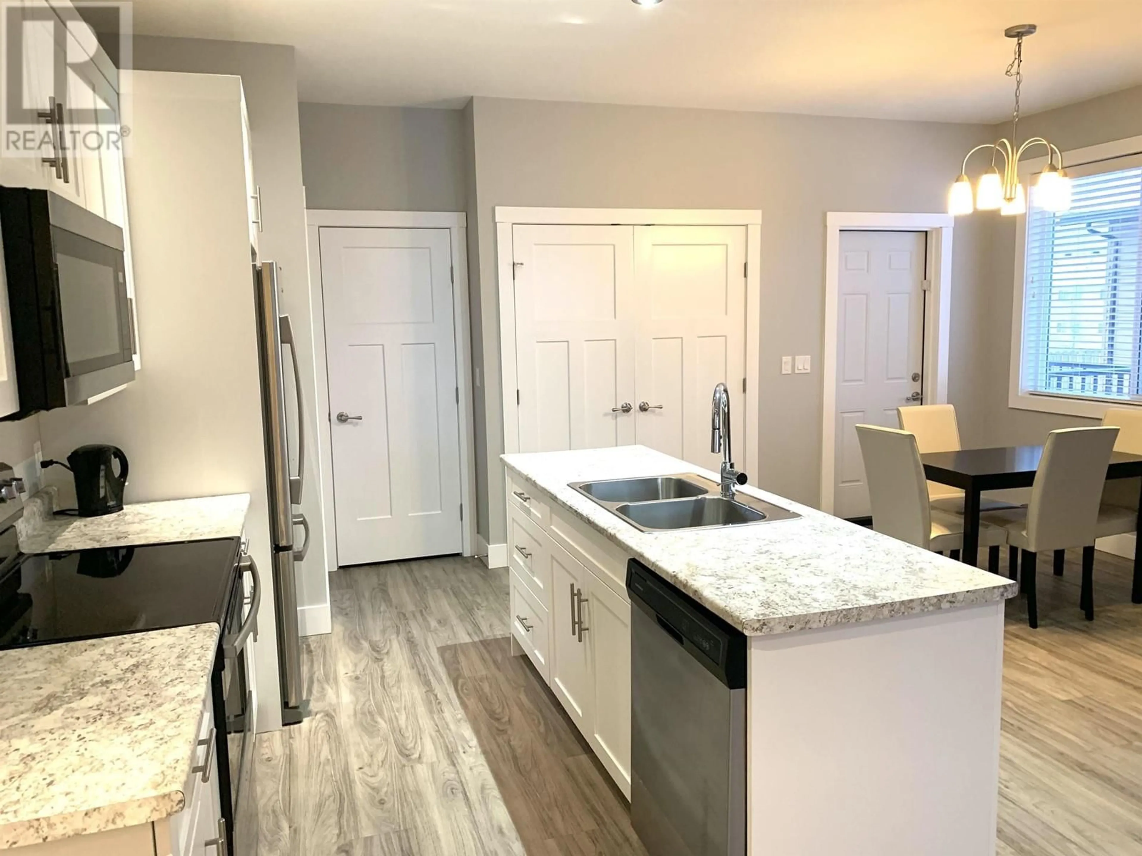 Open concept kitchen, unknown for 8620 85 STREET, Fort St. John British Columbia V1J0S2