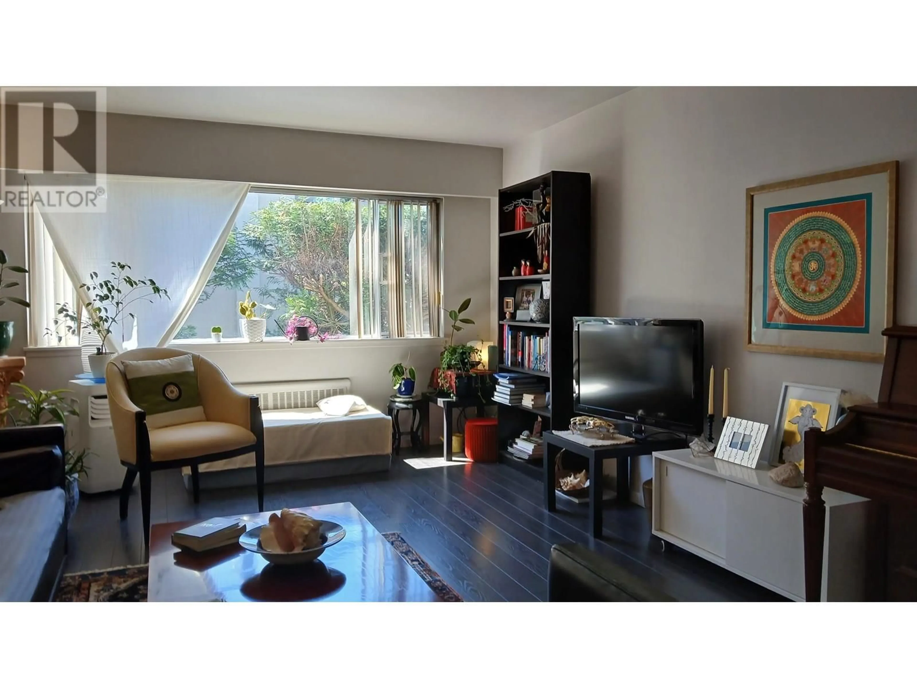 Living room with furniture, wood/laminate floor for 105 - 2250 43RD AVENUE, Vancouver British Columbia V6M2E3
