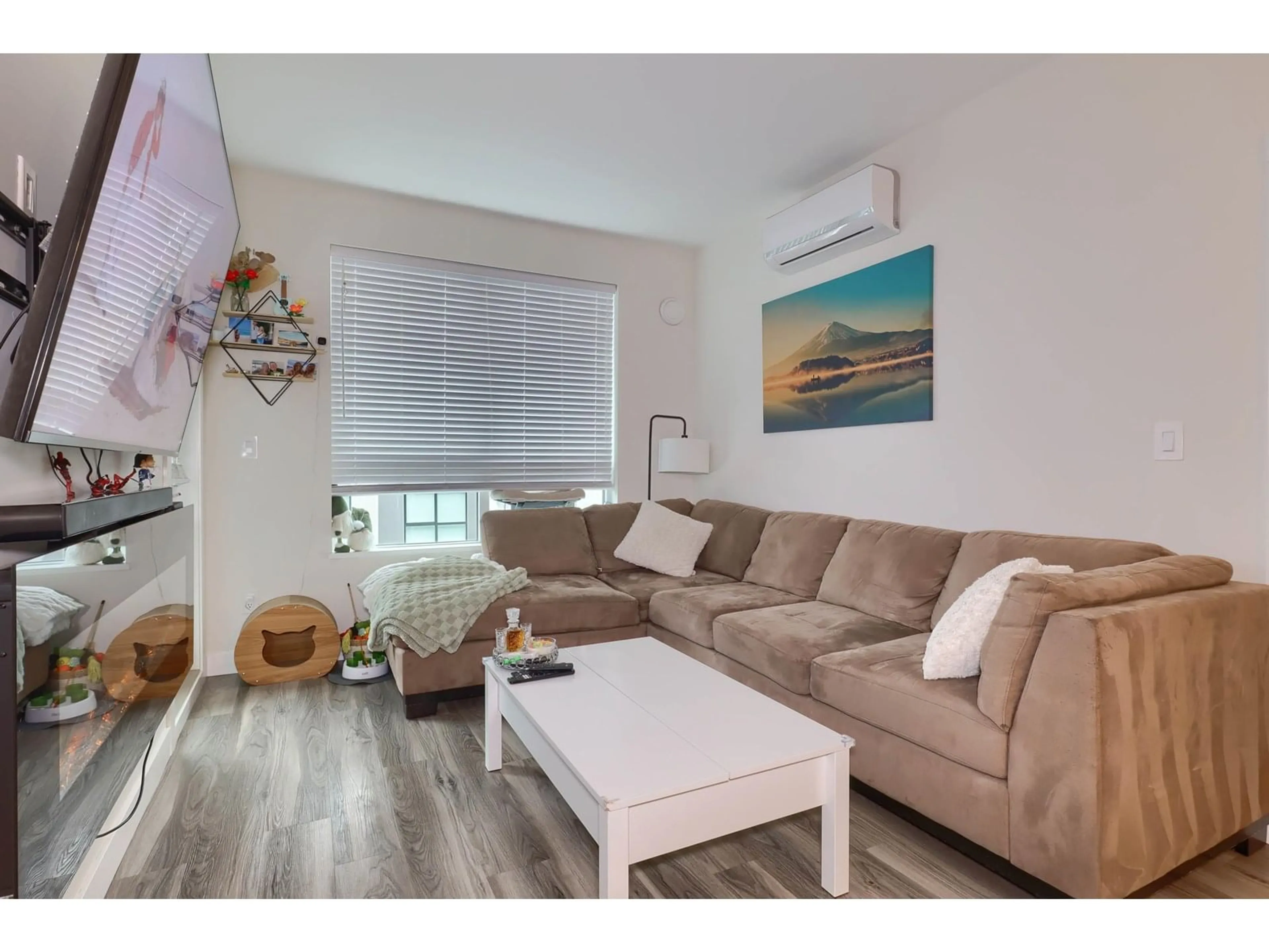 Living room with furniture, wood/laminate floor for 307 - 20356 72B, Langley British Columbia V2Y4J9