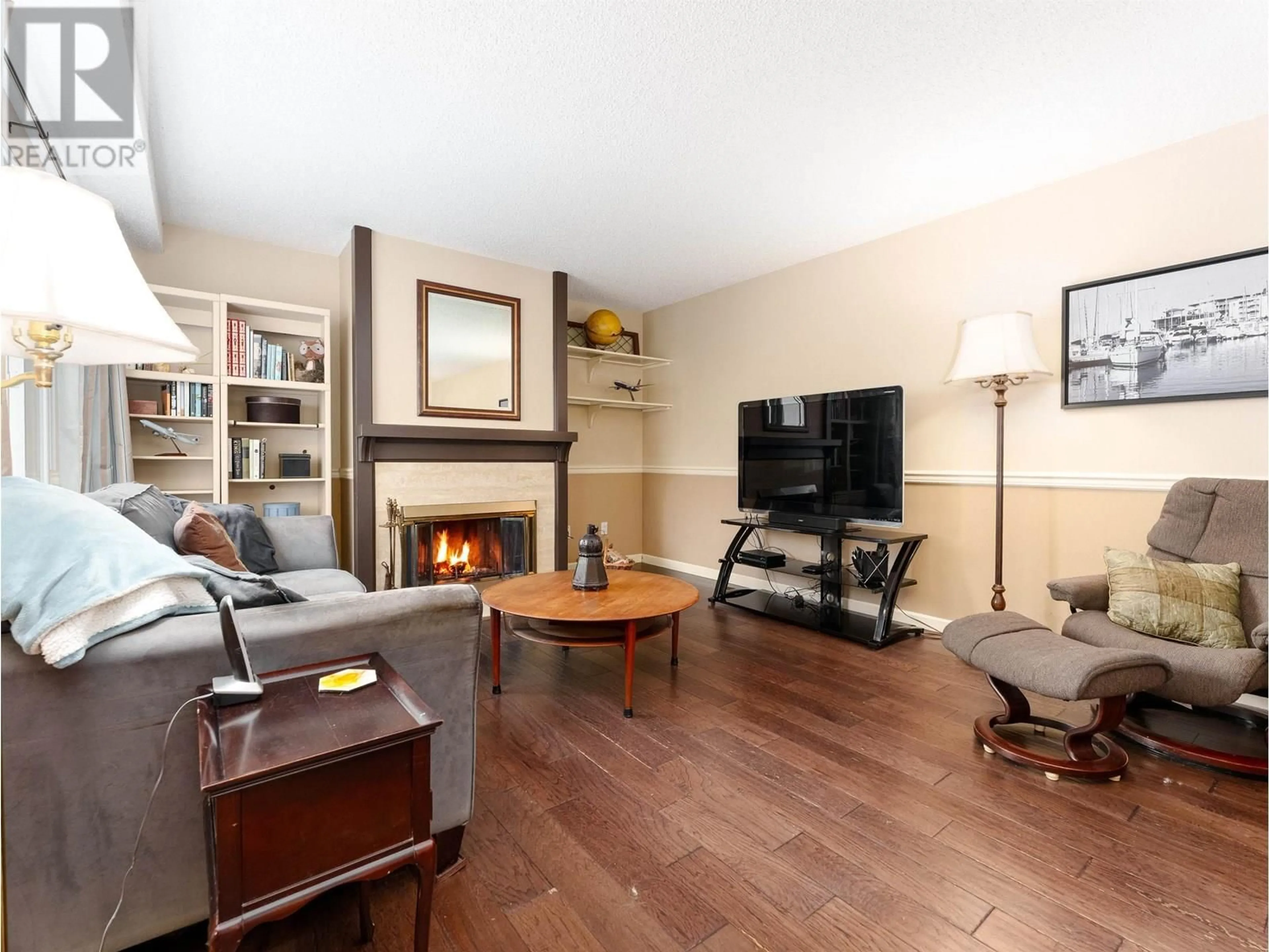 Living room with furniture, wood/laminate floor for 8226 VIVALDI PLACE, Vancouver British Columbia V5S4G6
