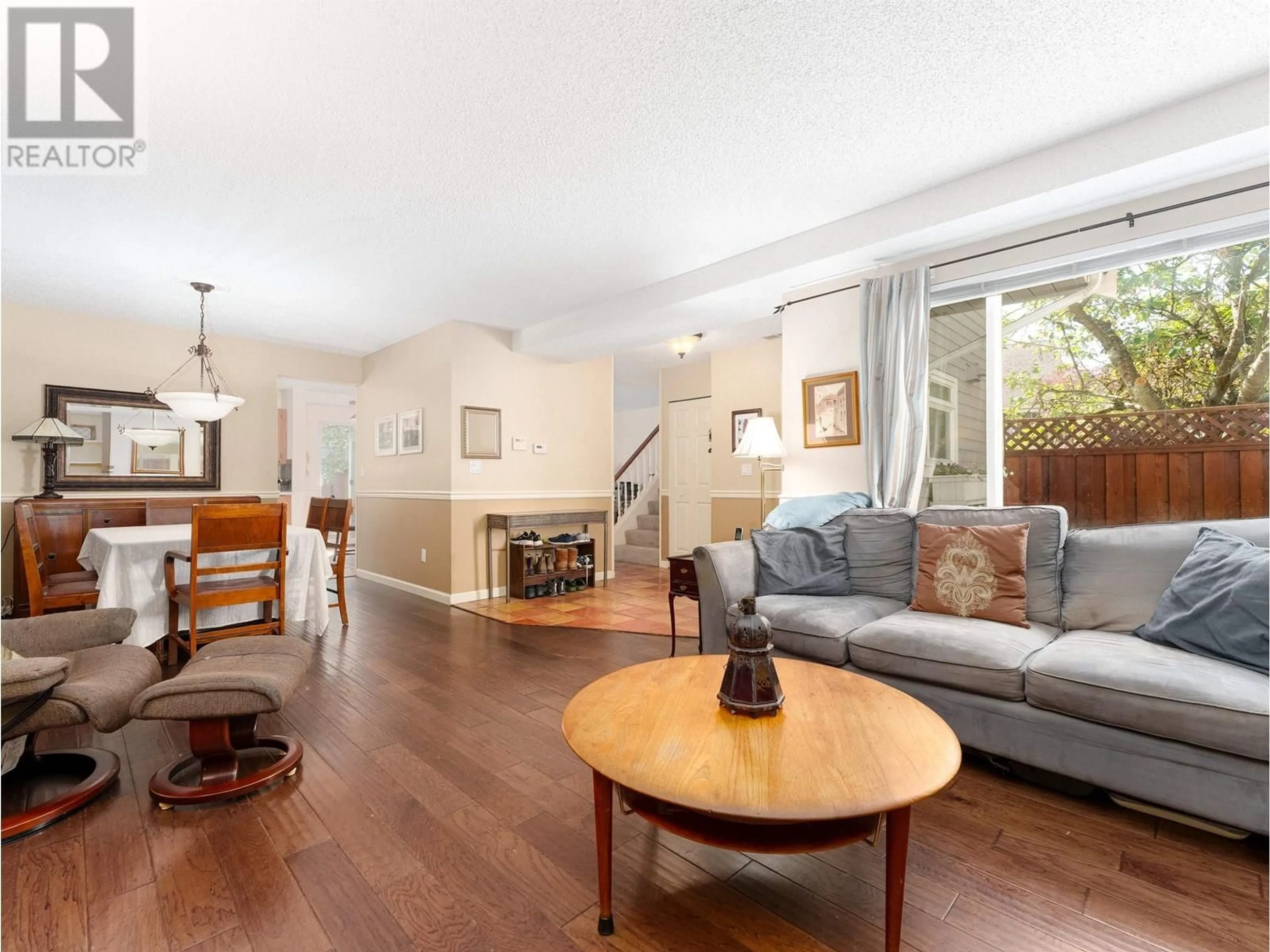 Living room with furniture, wood/laminate floor for 8226 VIVALDI PLACE, Vancouver British Columbia V5S4G6