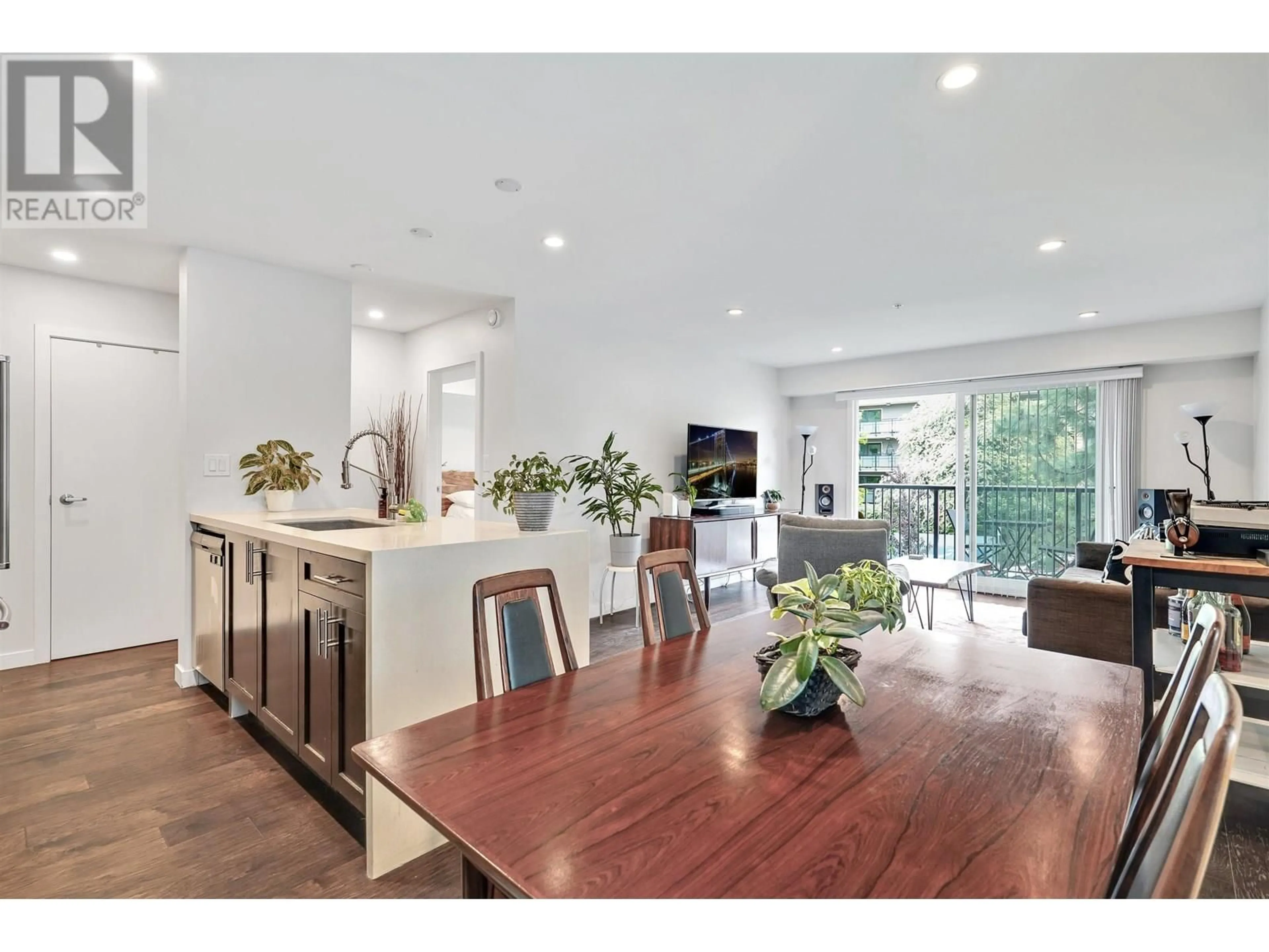 Open concept kitchen, wood/laminate floor for 302 - 357 2ND STREET, North Vancouver British Columbia V7L1C6