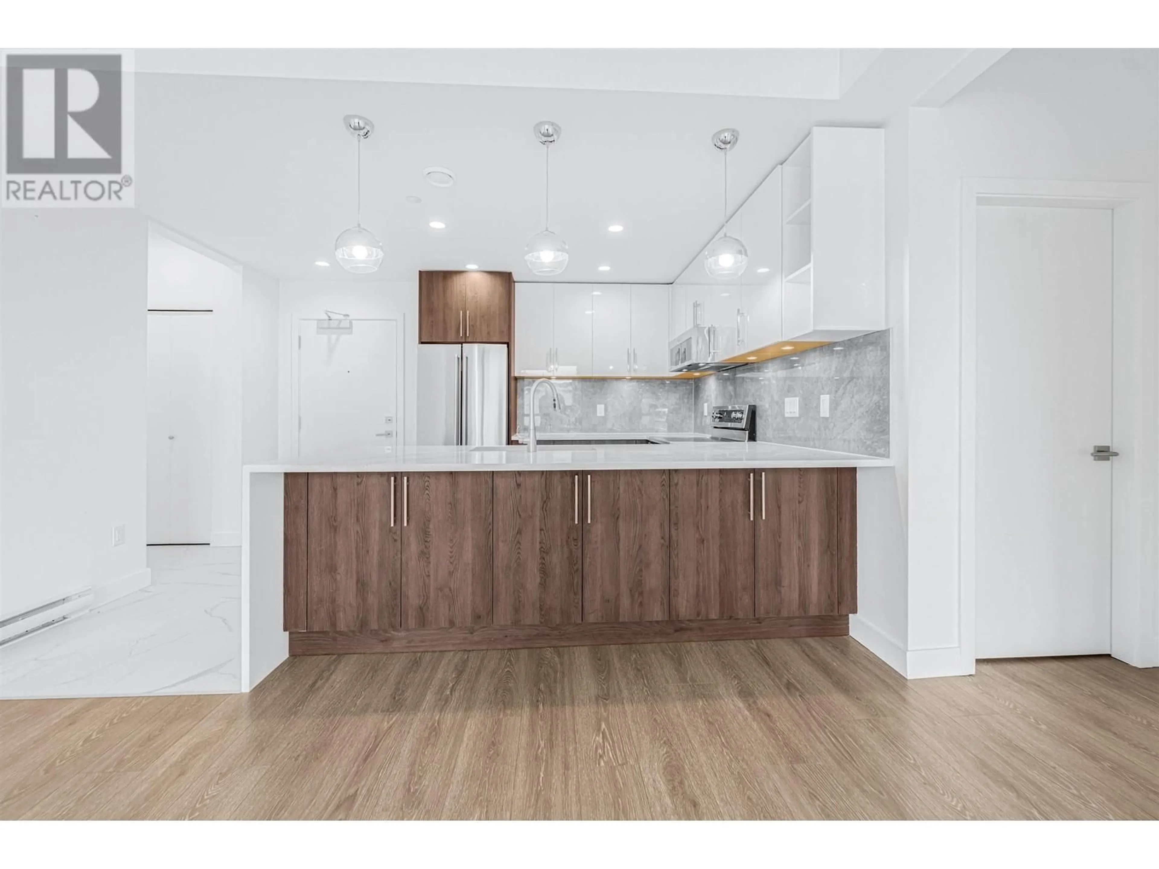 Open concept kitchen, wood/laminate floor for 304 - 11703 FRASER STREET, Maple Ridge British Columbia V2X9A7