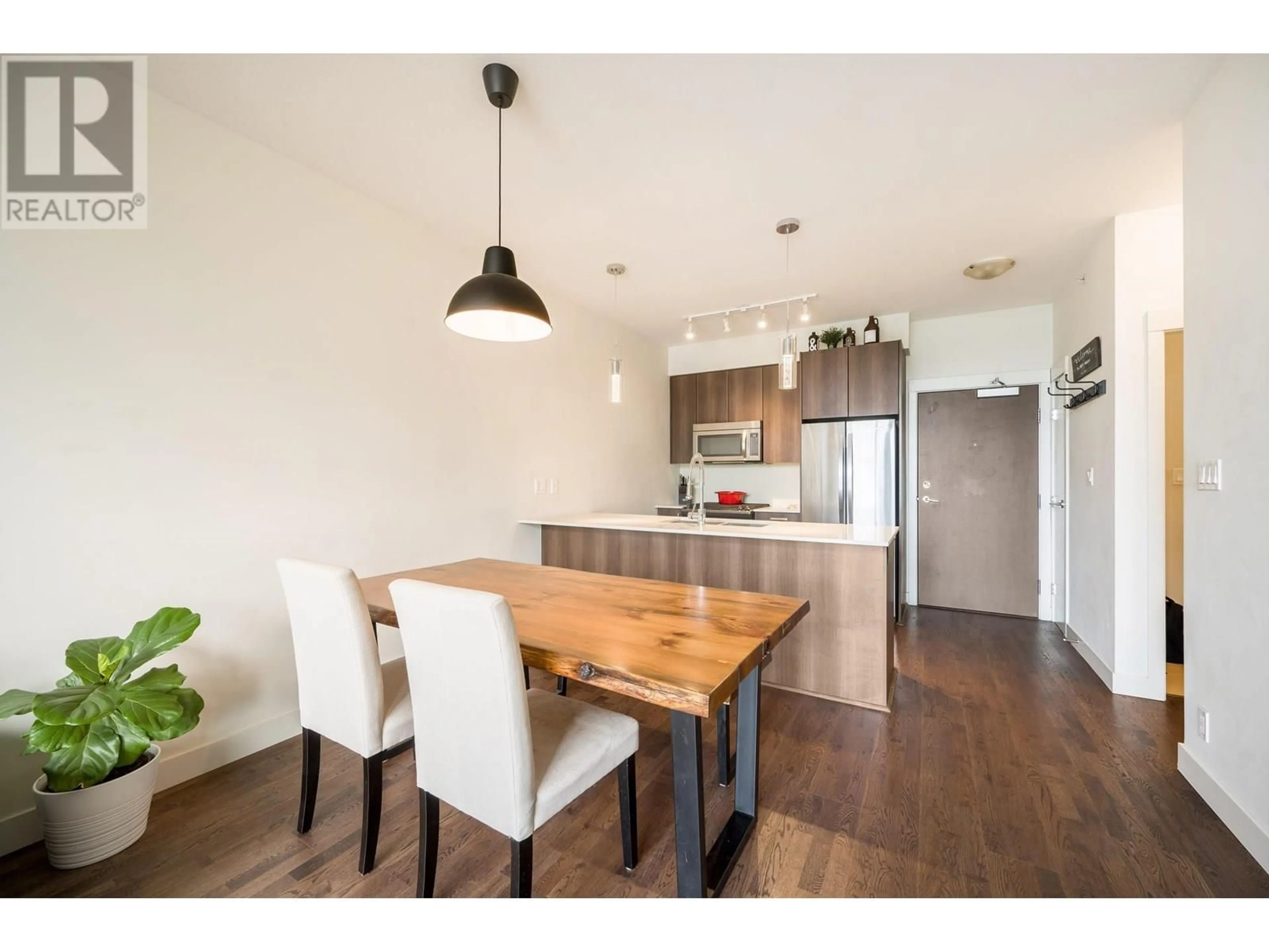 Open concept kitchen, wood/laminate floor for 406 - 7088 14TH AVENUE, Burnaby British Columbia V3N0E7