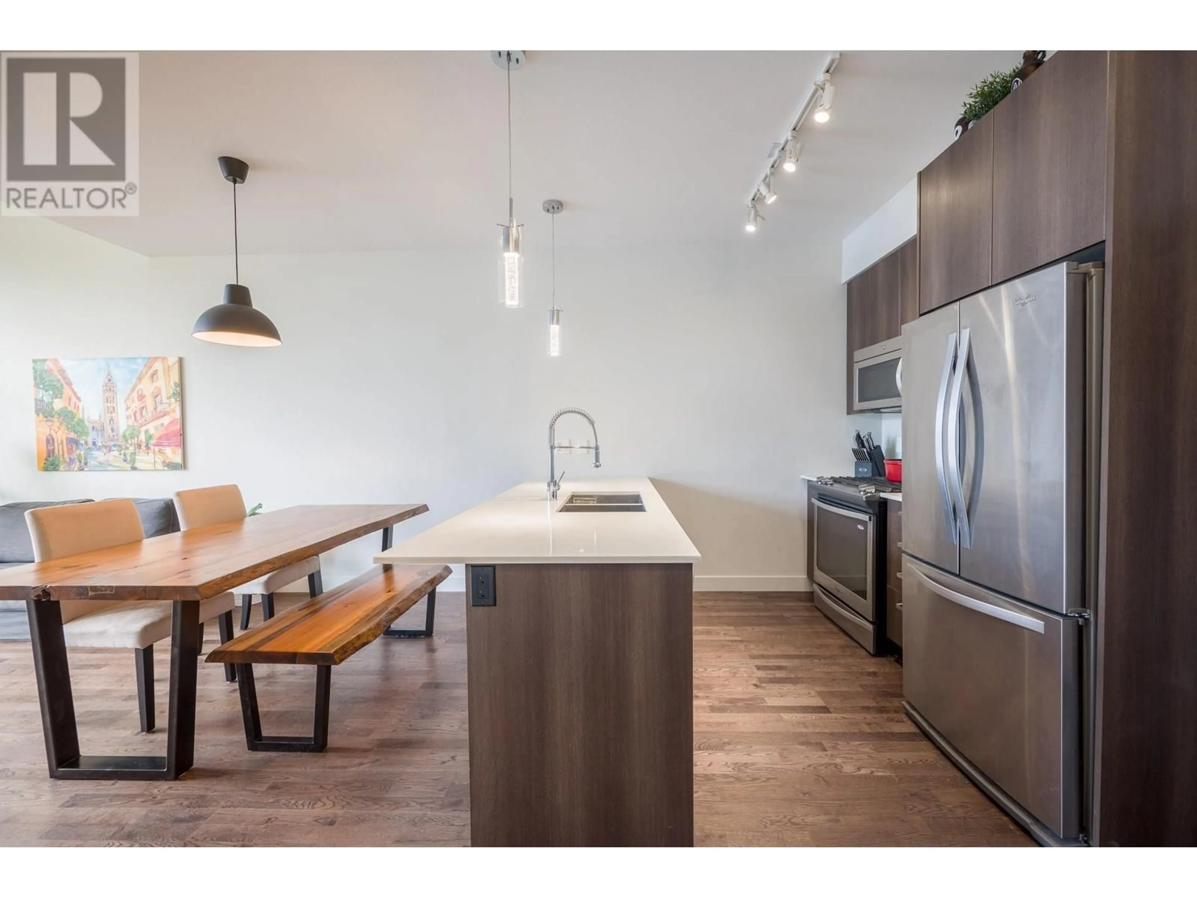 Open concept kitchen, wood/laminate floor for 406 - 7088 14TH AVENUE, Burnaby British Columbia V3N0E7
