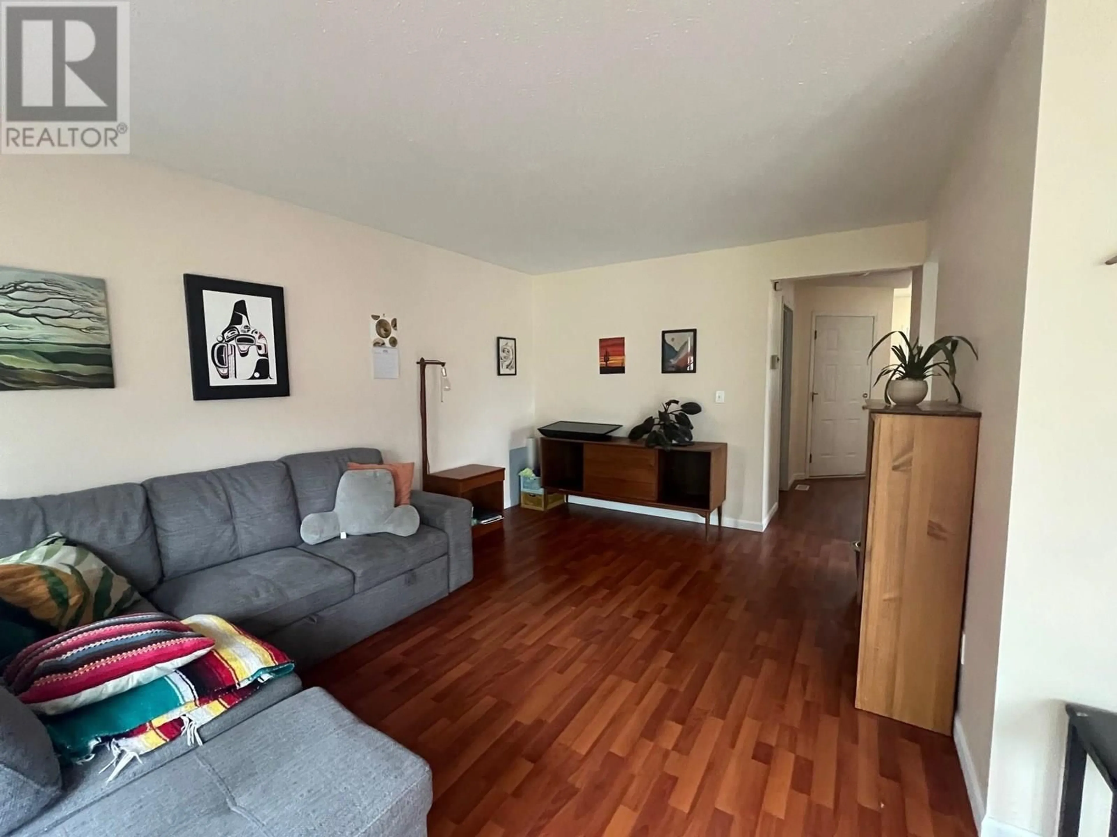 Living room with furniture, wood/laminate floor for 4223 ASTLAIS PLACE, Smithers British Columbia V0J2N0