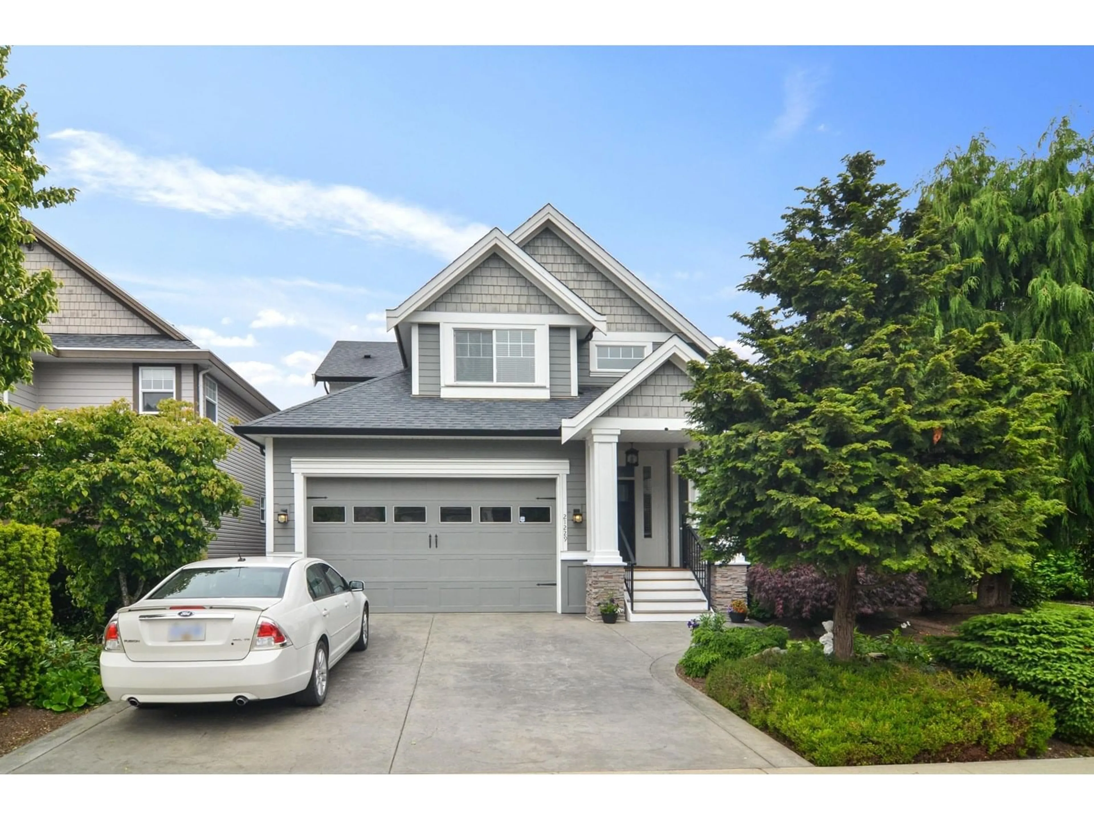 Home with vinyl exterior material, street for 21229 83A, Langley British Columbia V2Y0C2