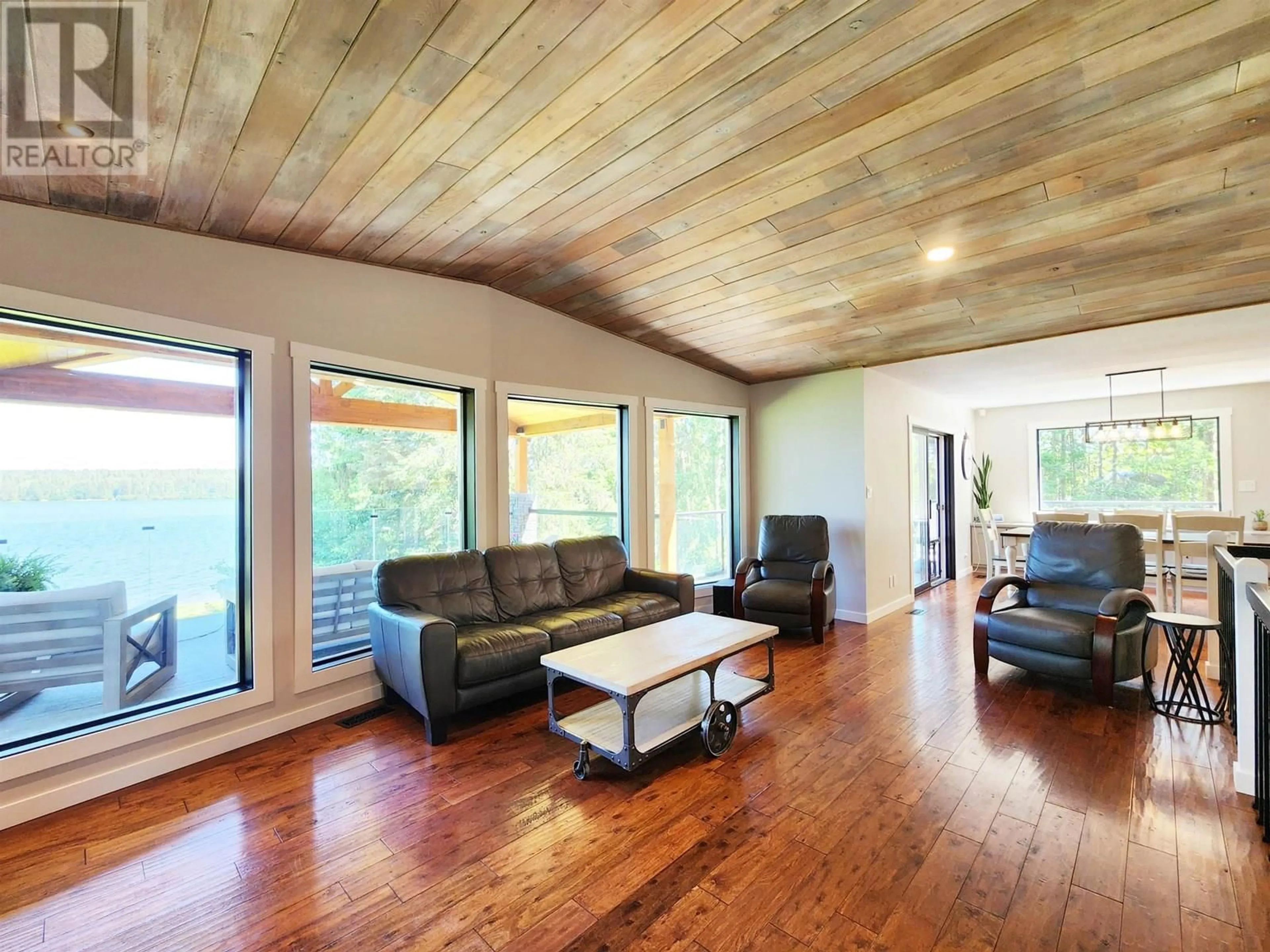 Living room with furniture, wood/laminate floor for 4864 TEN MILE LAKE ROAD, Quesnel British Columbia V2J6X1