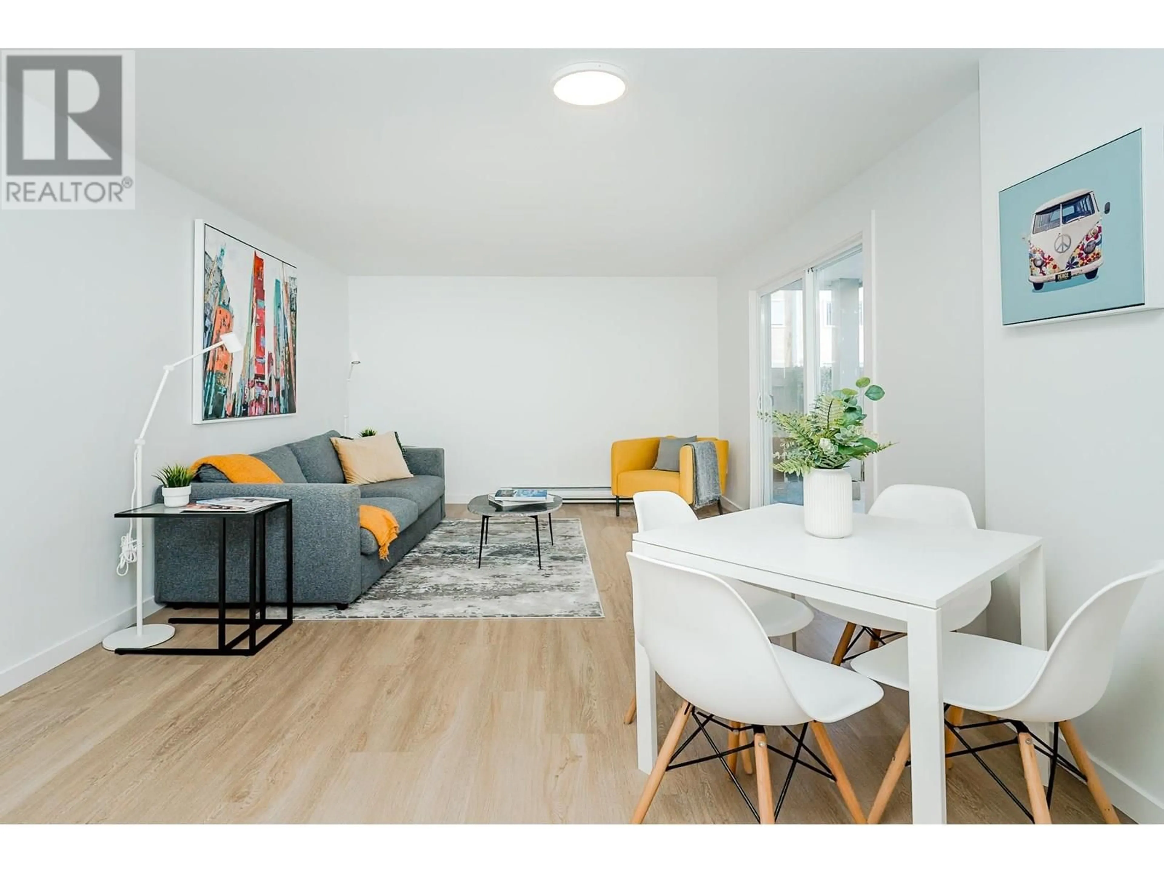 Living room with furniture, wood/laminate floor for 102 - 8690 MONTCALM STREET, Vancouver British Columbia V6P4P8