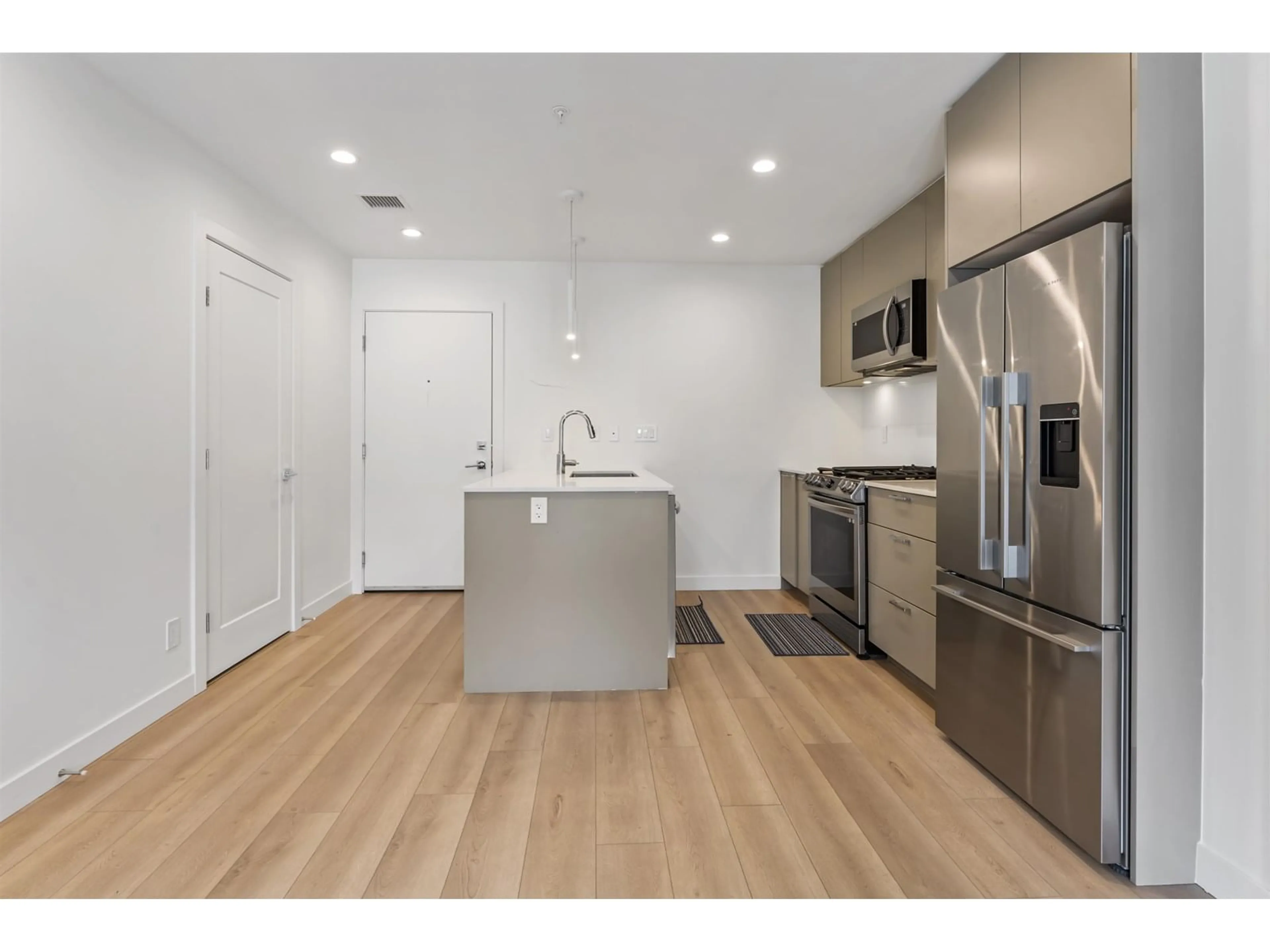 Open concept kitchen, wood/laminate floor for G603 - 8380 200A, Langley British Columbia V1M3Y4