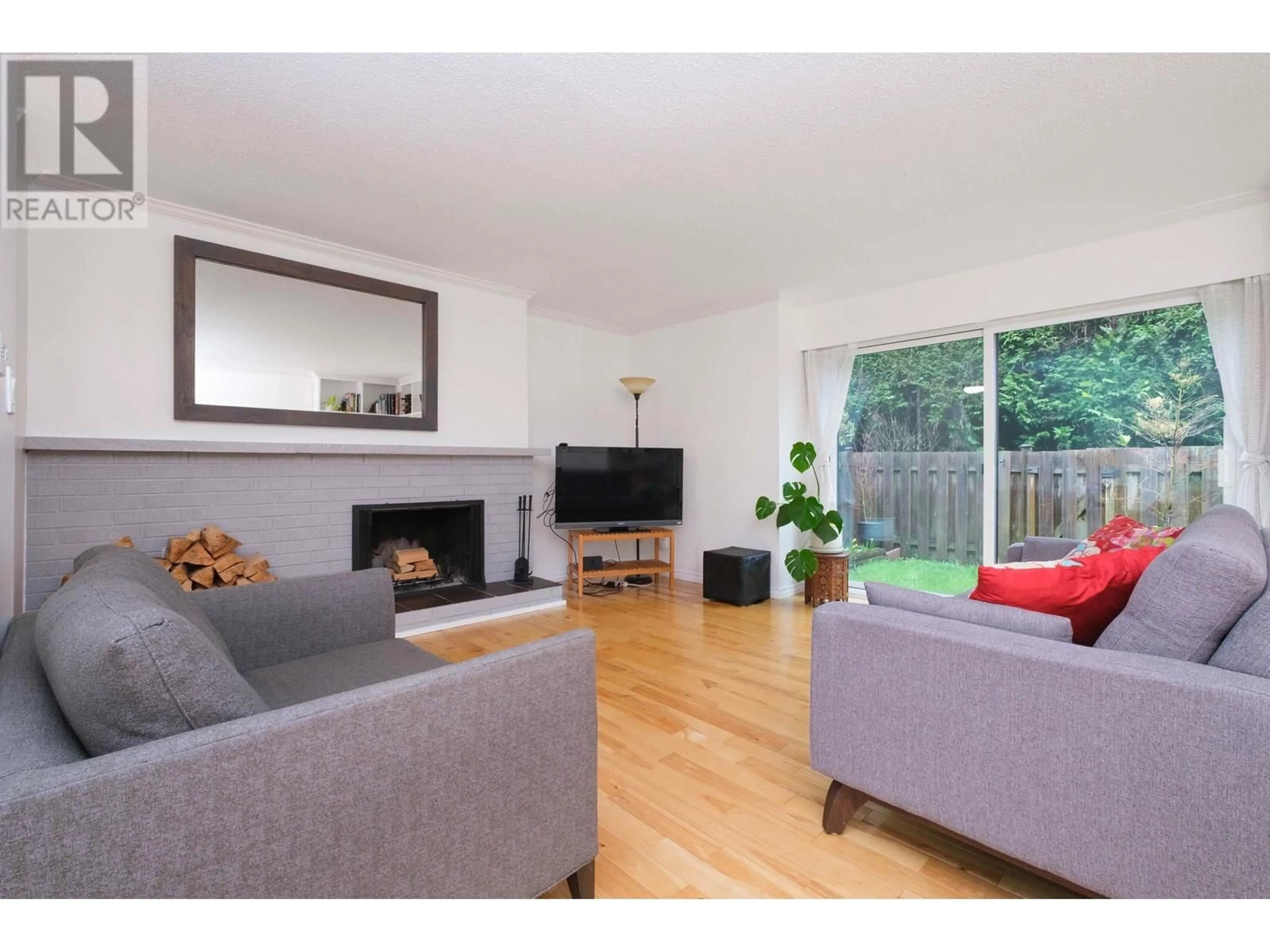 Living room with furniture, wood/laminate floor for 829 OLD LILLOOET ROAD, North Vancouver British Columbia V7J2H6