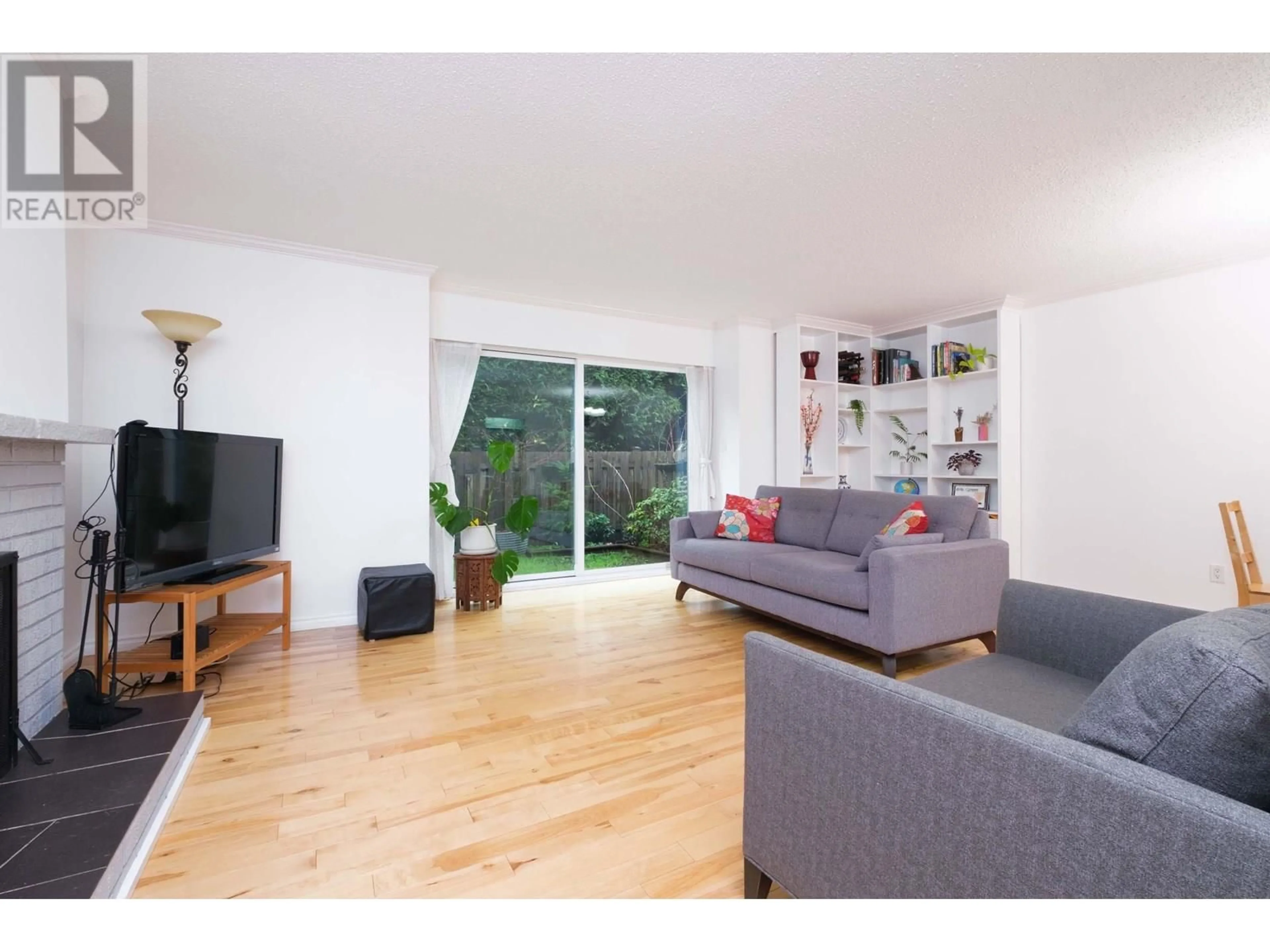 Living room with furniture, wood/laminate floor for 829 OLD LILLOOET ROAD, North Vancouver British Columbia V7J2H6