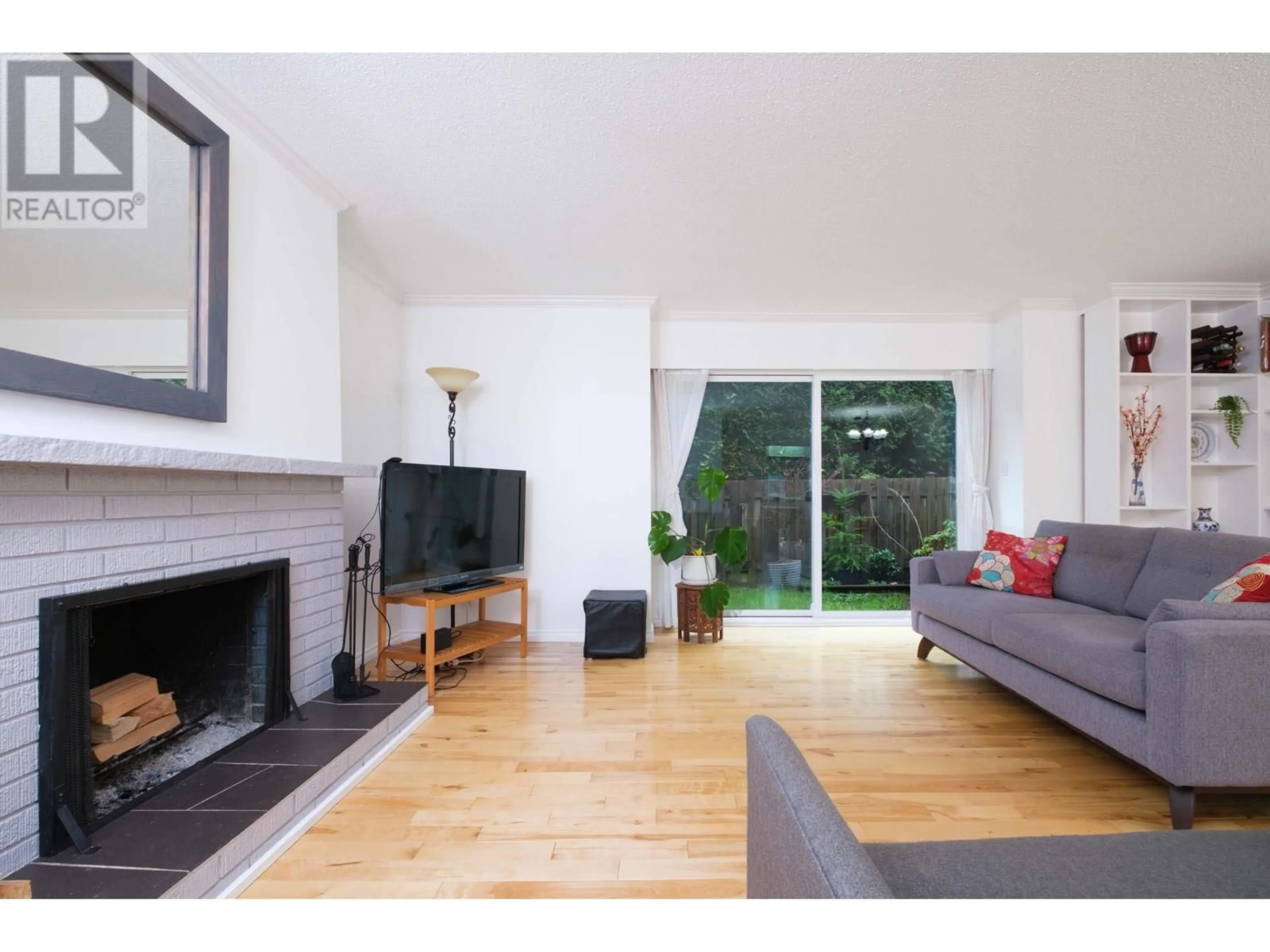 Living room with furniture, wood/laminate floor for 829 OLD LILLOOET ROAD, North Vancouver British Columbia V7J2H6