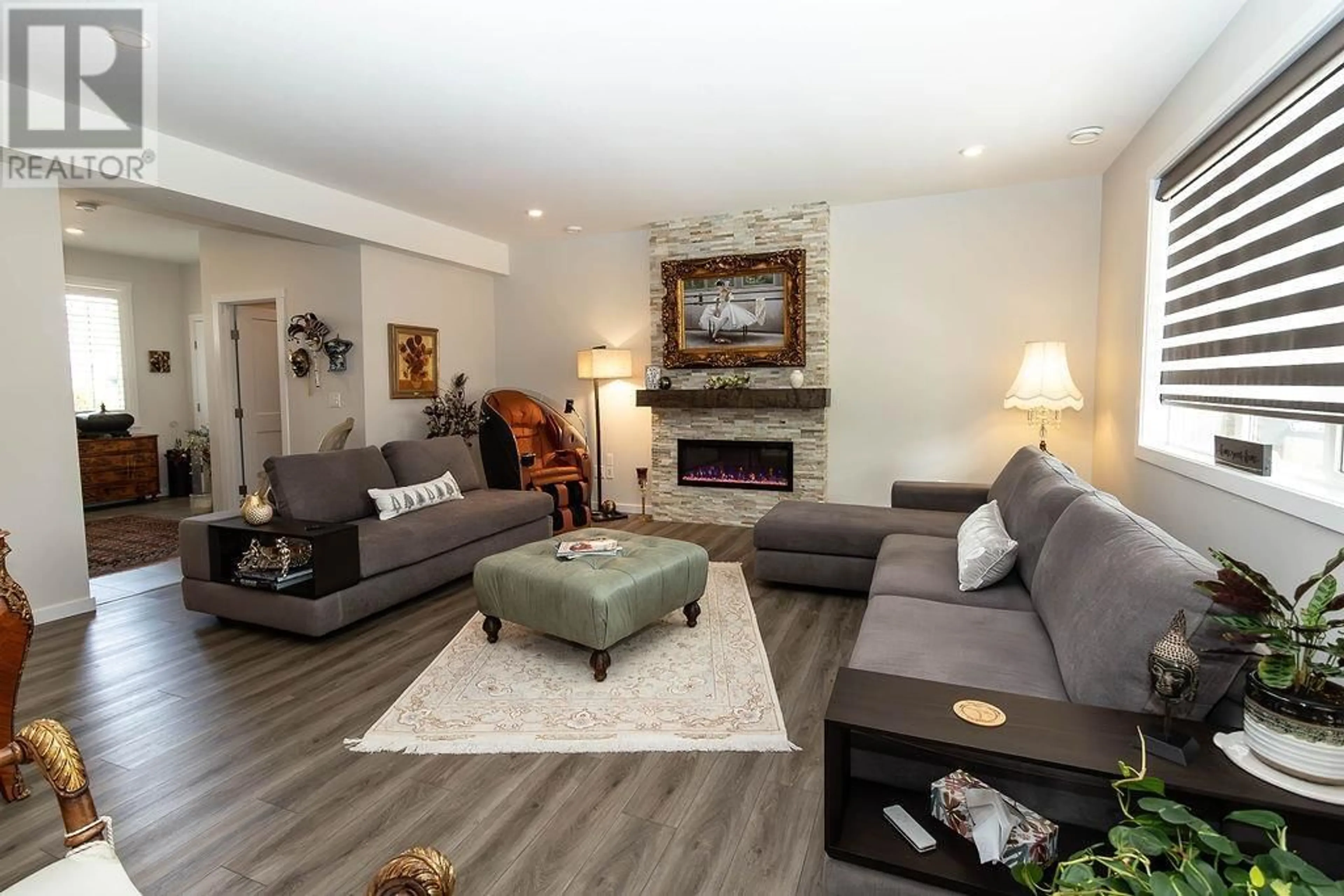 Living room with furniture, wood/laminate floor for 5113 COHO PLACE, Terrace British Columbia V8G5L7