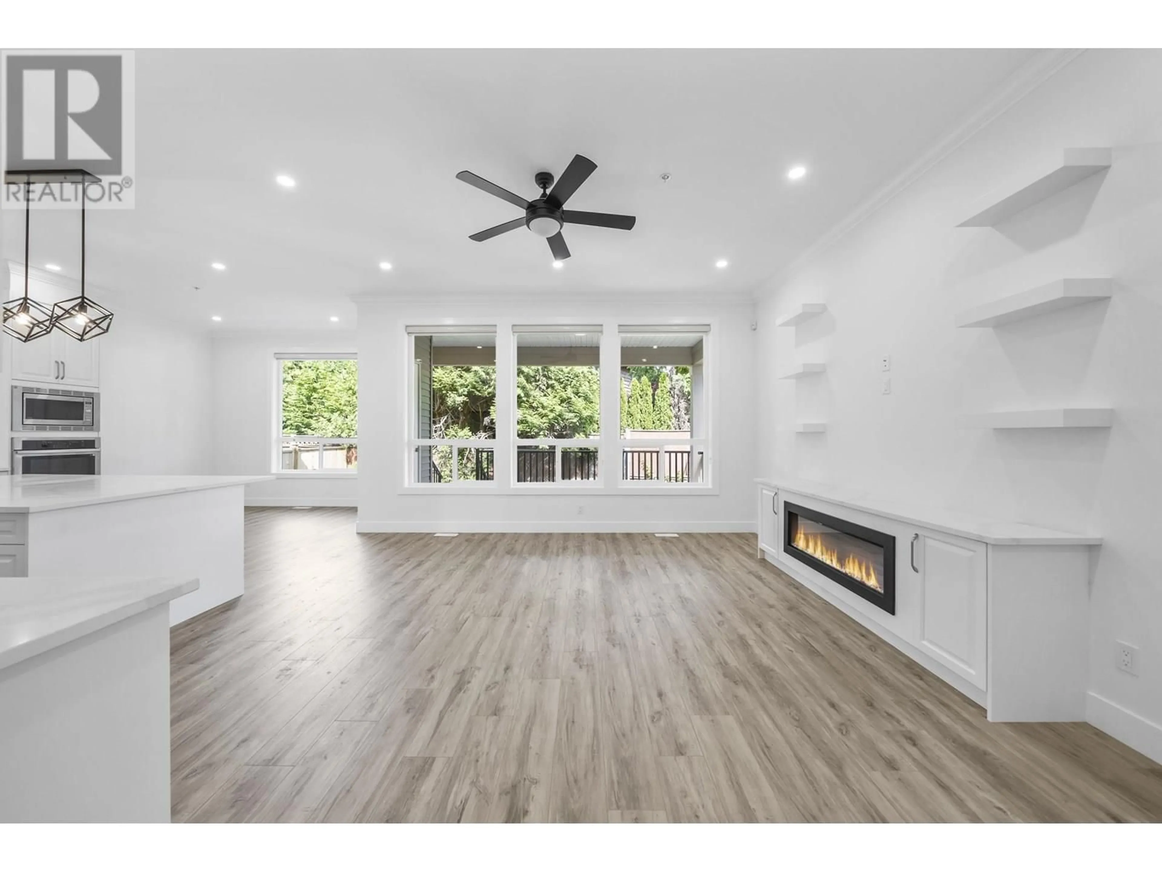 Open concept kitchen, wood/laminate floor for 11860 BLAKELY ROAD, Pitt Meadows British Columbia V3Y2G9