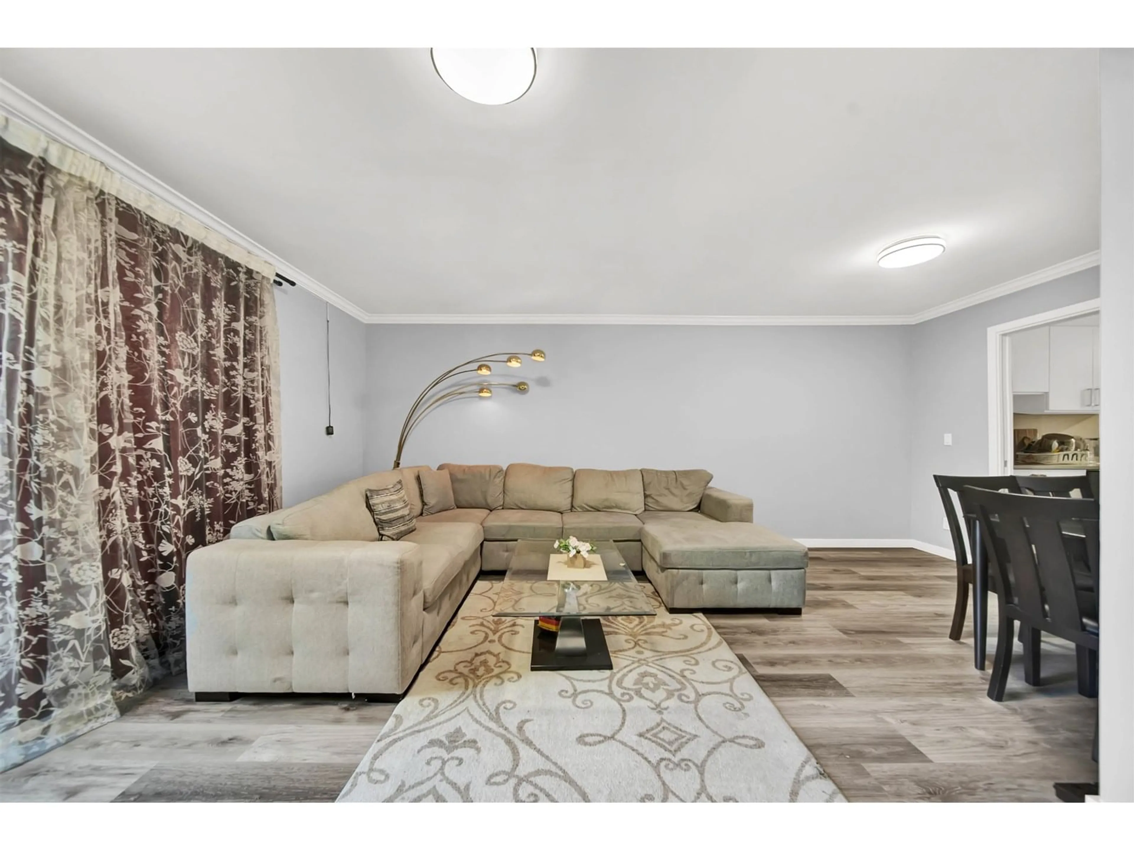 Living room with furniture, wood/laminate floor for 240 - 9454 PRINCE CHARLES, Surrey British Columbia V3V1S6