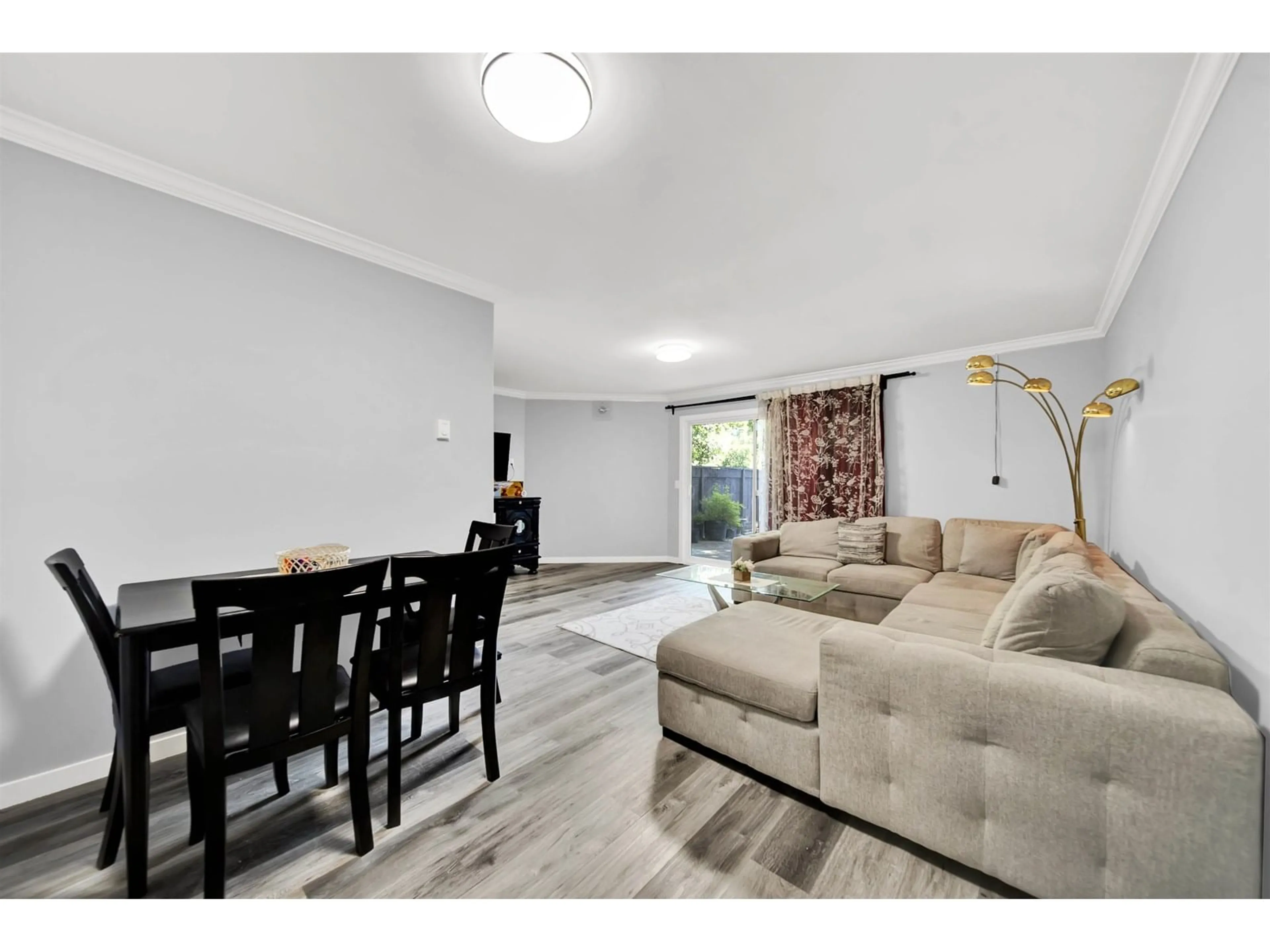 Living room with furniture, wood/laminate floor for 240 - 9454 PRINCE CHARLES, Surrey British Columbia V3V1S6