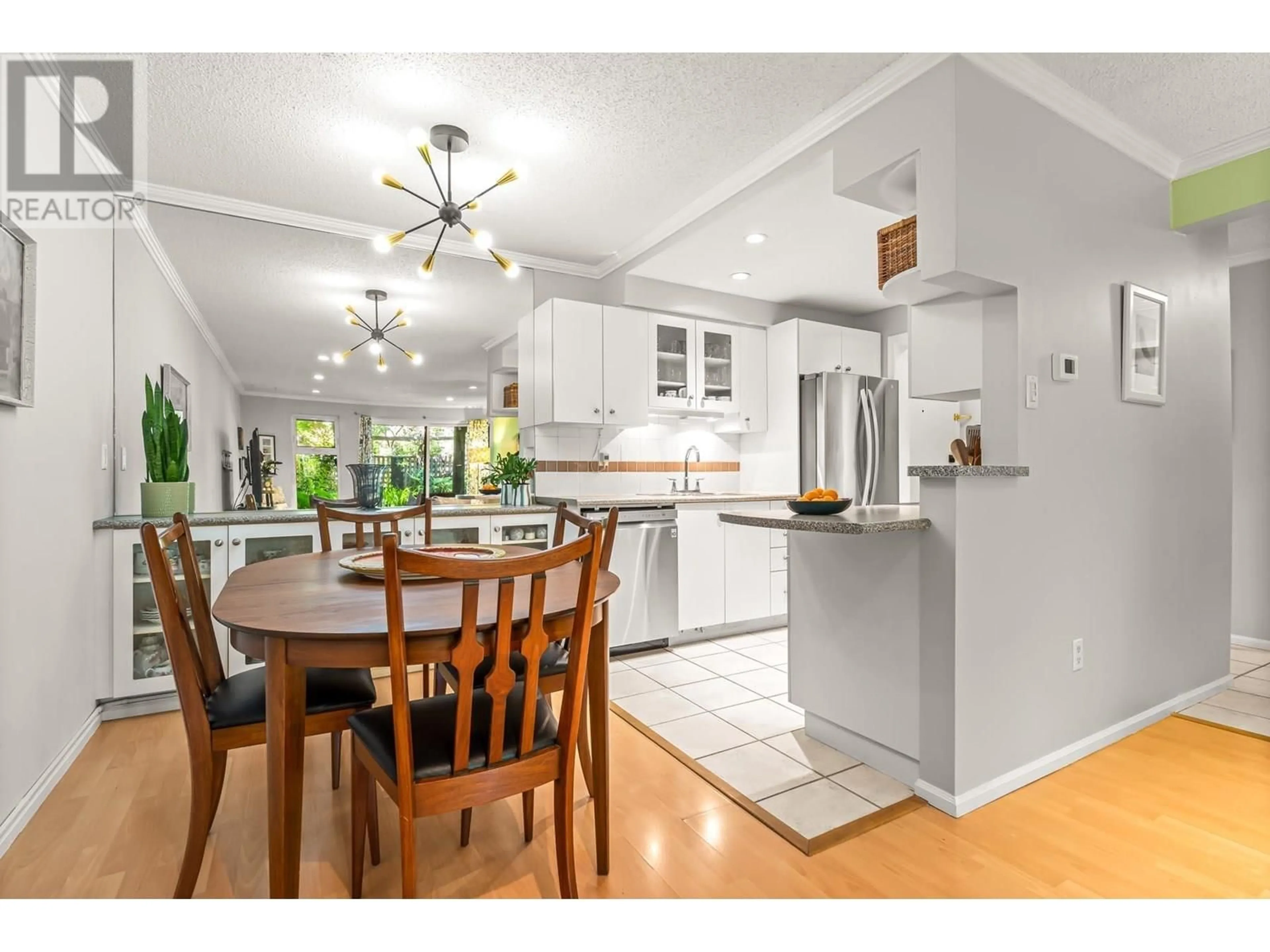 Open concept kitchen, wood/laminate floor for 223 - 7055 WILMA STREET, Burnaby British Columbia V5E4B1