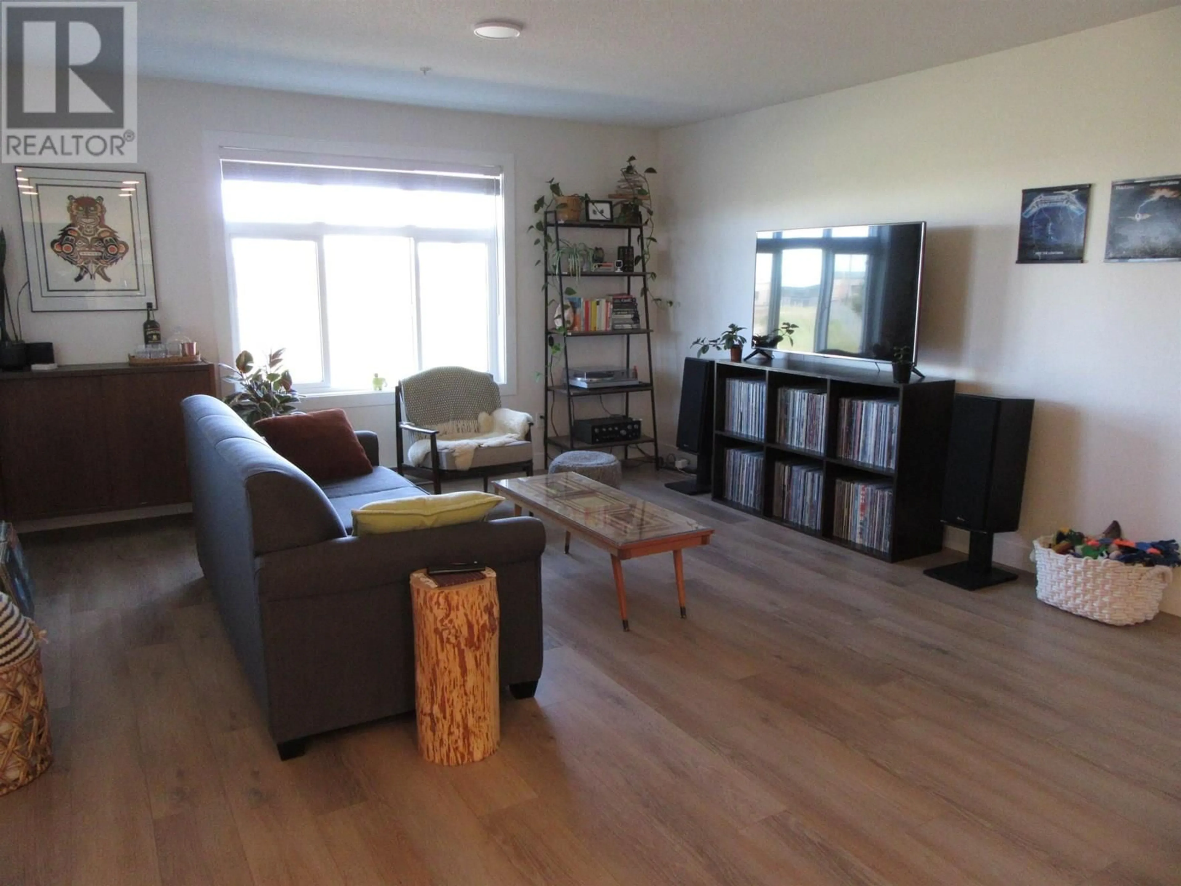 Living room with furniture, wood/laminate floor for 110 - 4278 22ND AVENUE, Prince George British Columbia V2N0J4