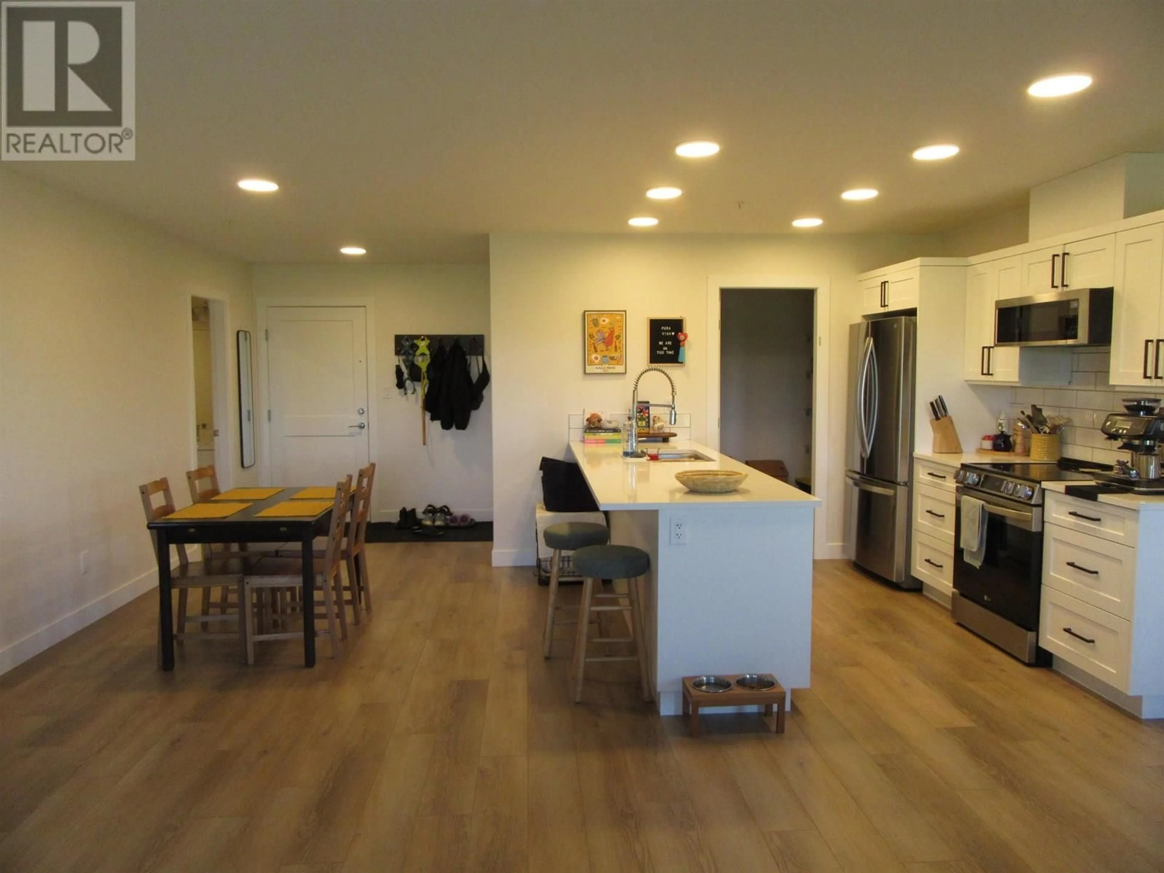 Open concept kitchen, wood/laminate floor for 110 - 4278 22ND AVENUE, Prince George British Columbia V2N0J4