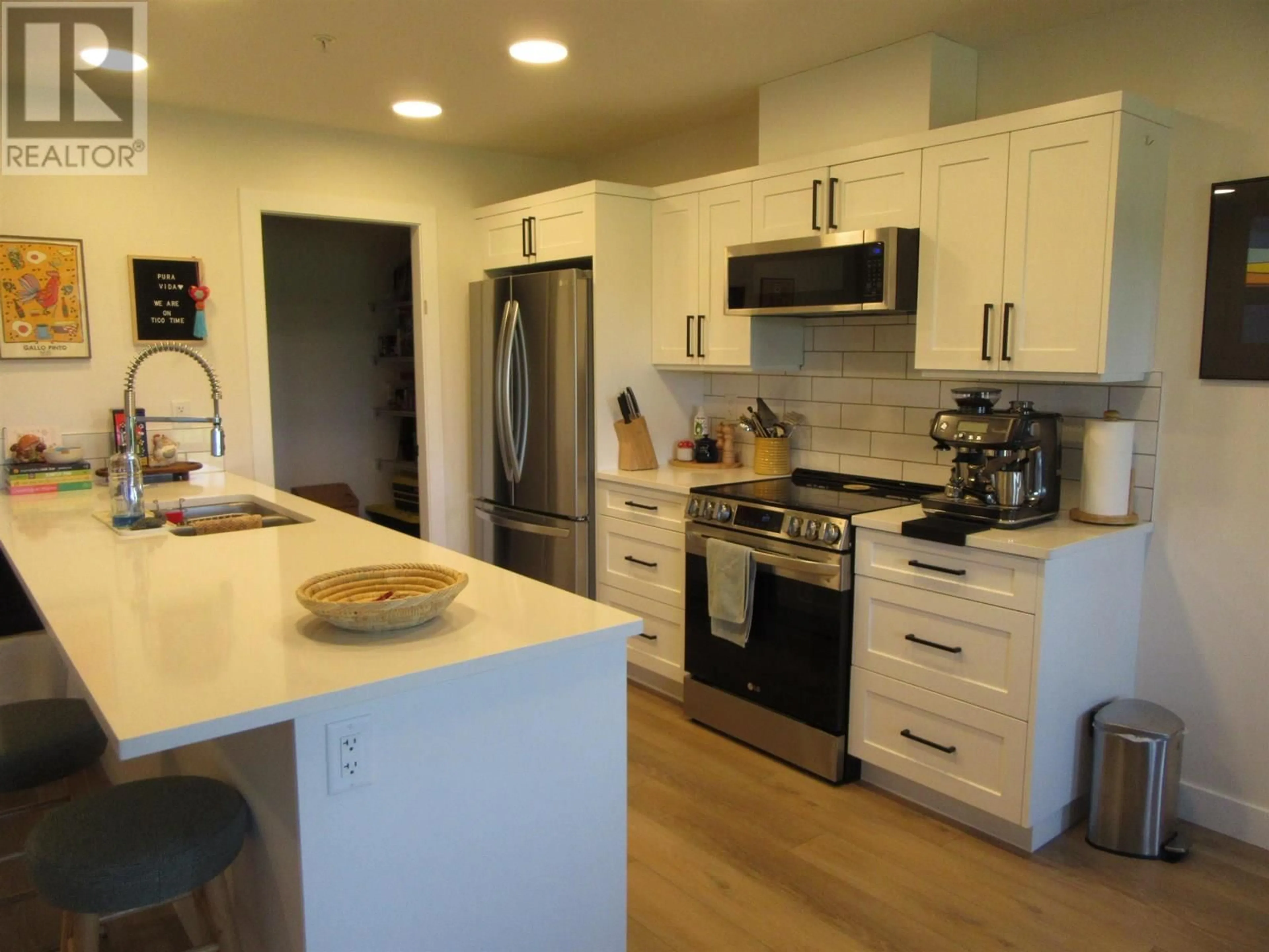 Open concept kitchen, wood/laminate floor for 110 - 4278 22ND AVENUE, Prince George British Columbia V2N0J4