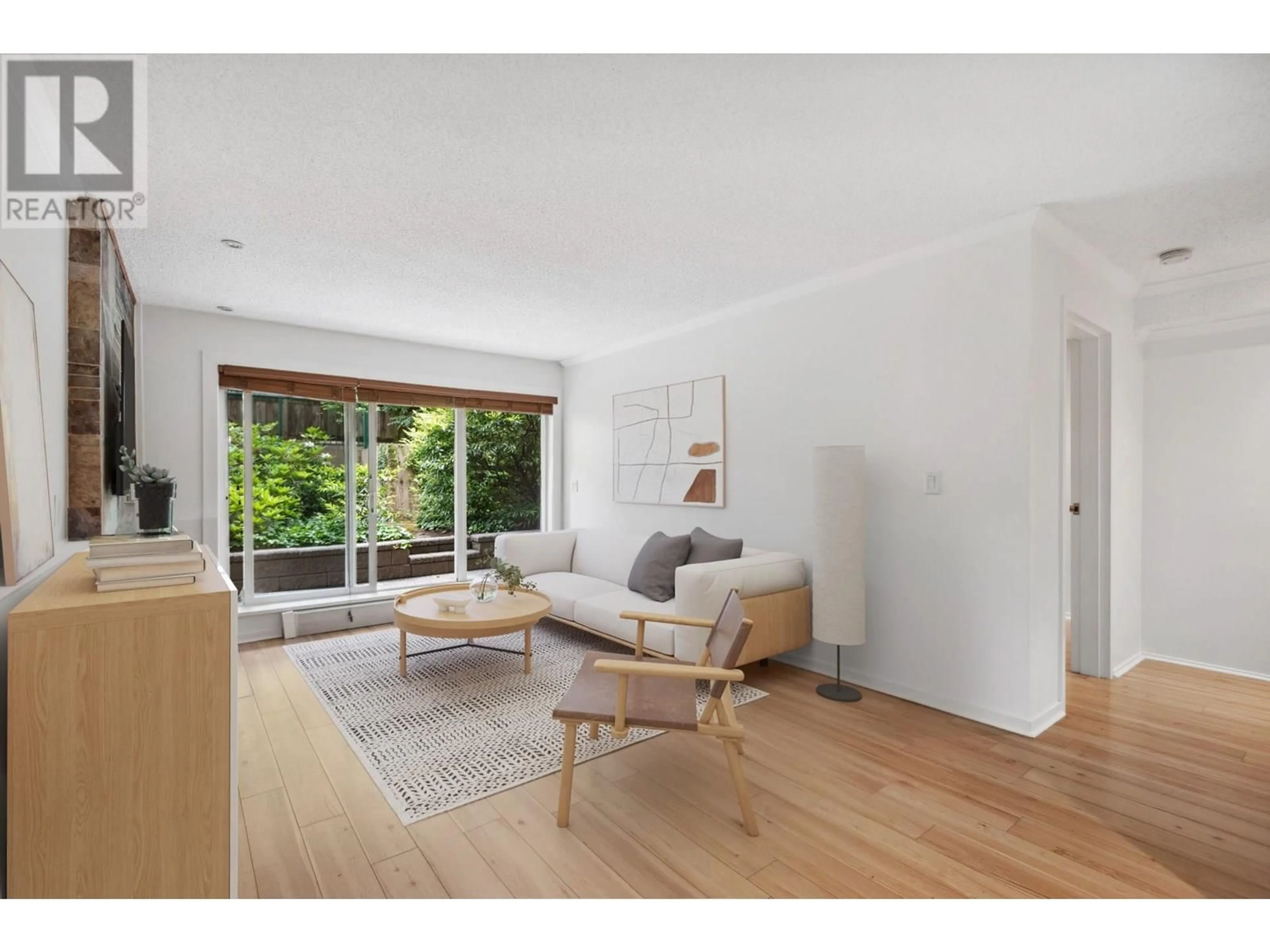 Living room with furniture, wood/laminate floor for 106 - 1169 NELSON STREET, Vancouver British Columbia V6E1J3