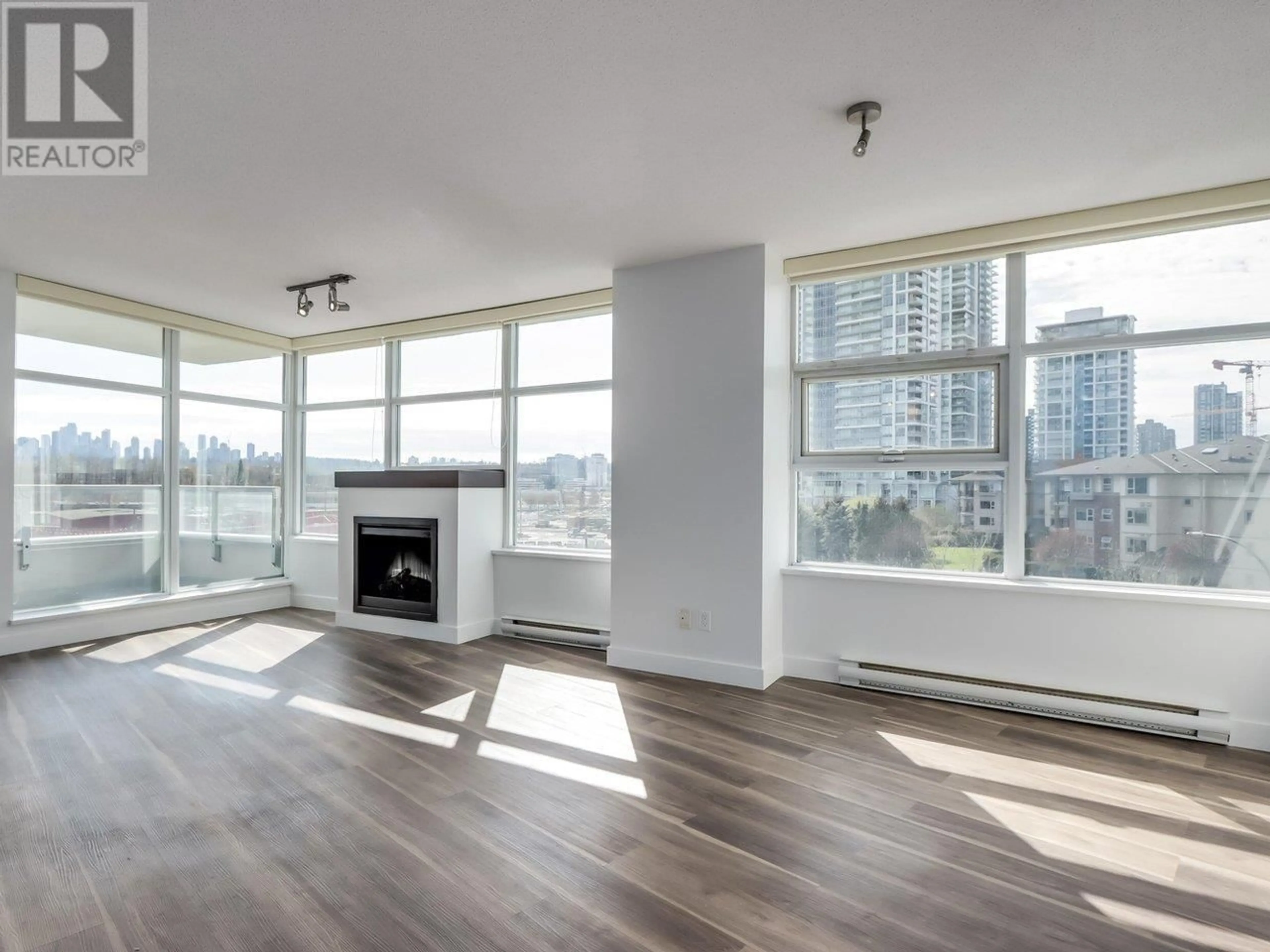 Living room with furniture, wood/laminate floor for 507 - 2289 YUKON CRESCENT, Burnaby British Columbia V5C0B2