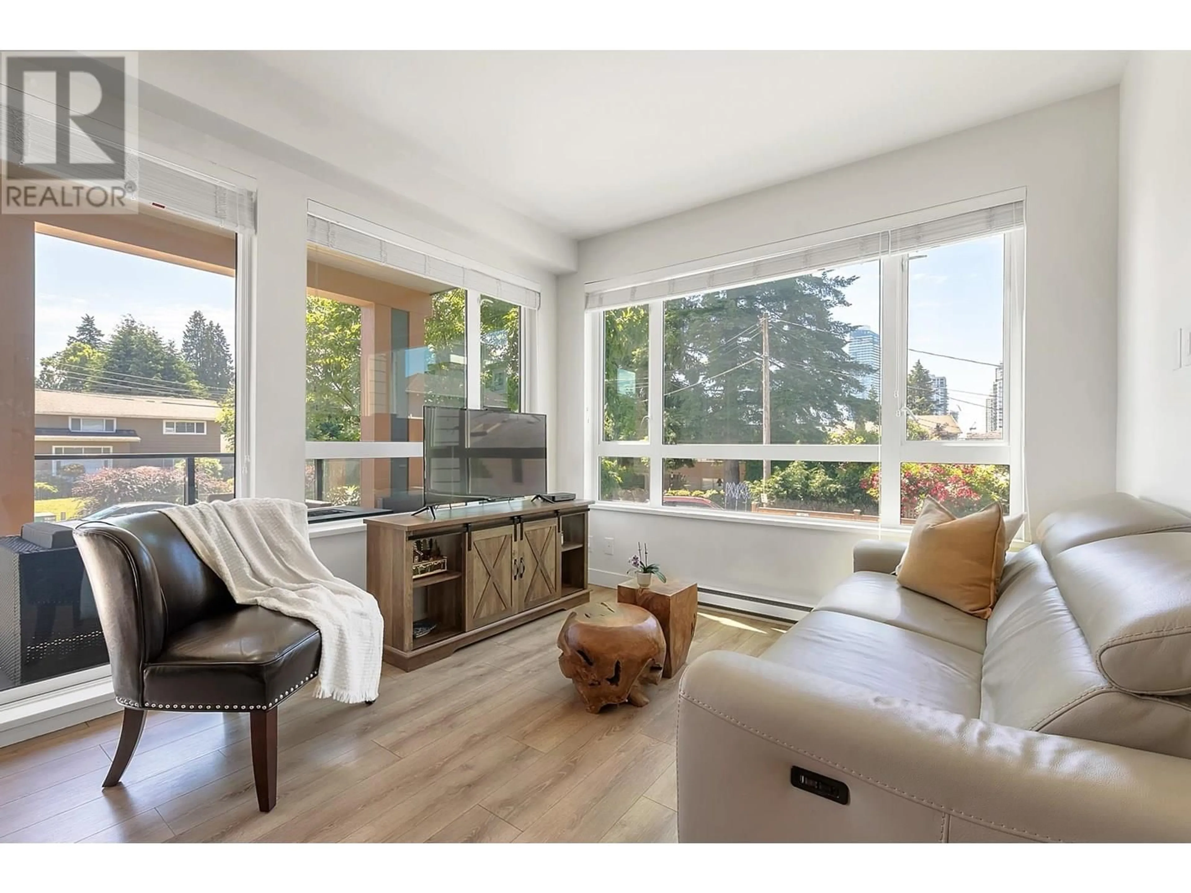 Living room with furniture, wood/laminate floor for 223 - 721 ANSKAR COURT, Coquitlam British Columbia V3J0L4