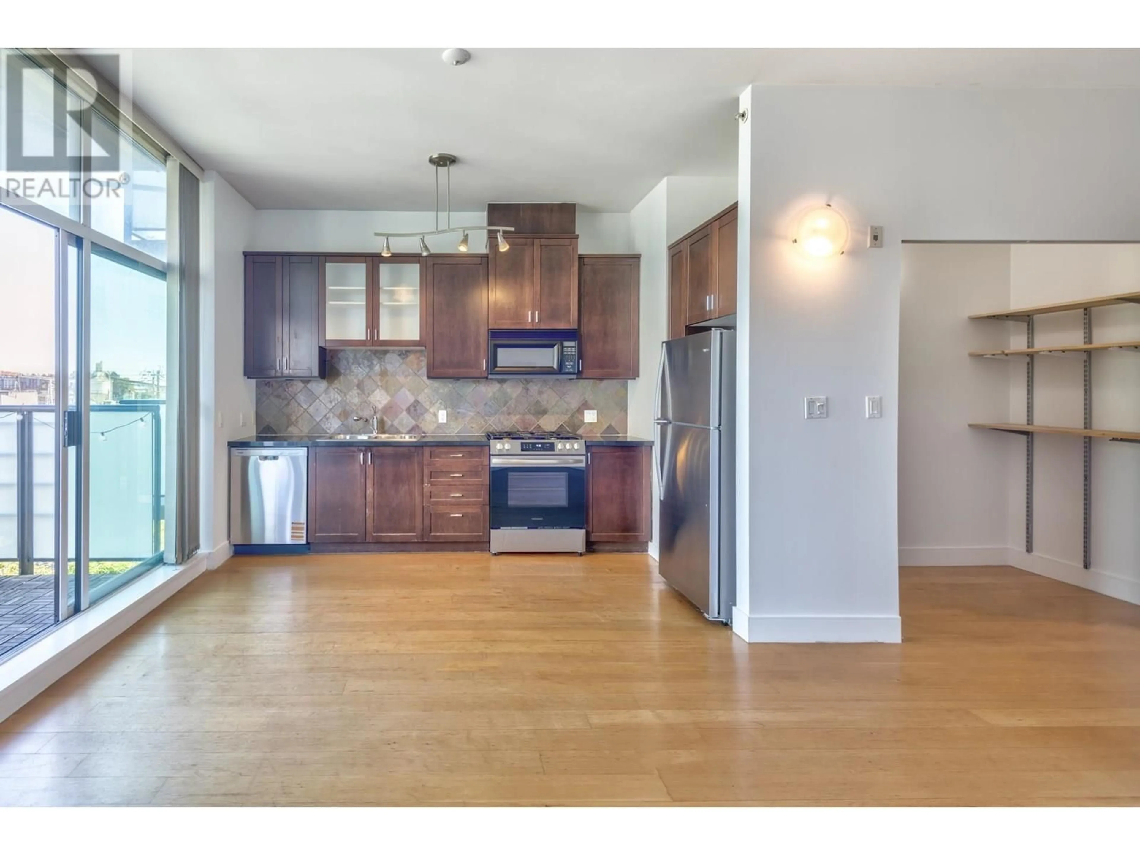 Open concept kitchen, wood/laminate floor for 413 - 8988 HUDSON STREET, Vancouver British Columbia V6P6Z1