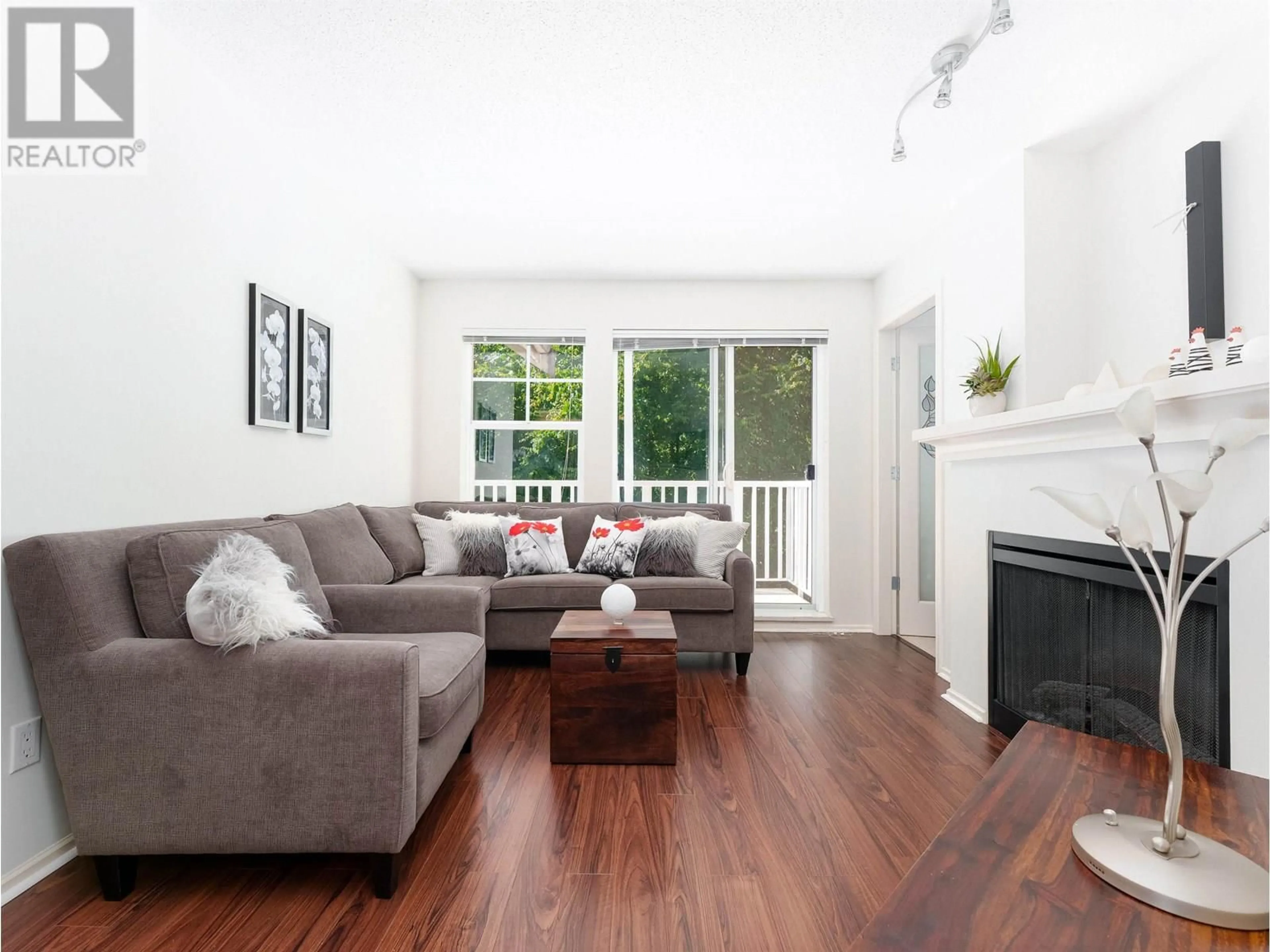 Living room with furniture, wood/laminate floor for 308 - 7330 SALISBURY AVENUE, Burnaby British Columbia V5E4N8