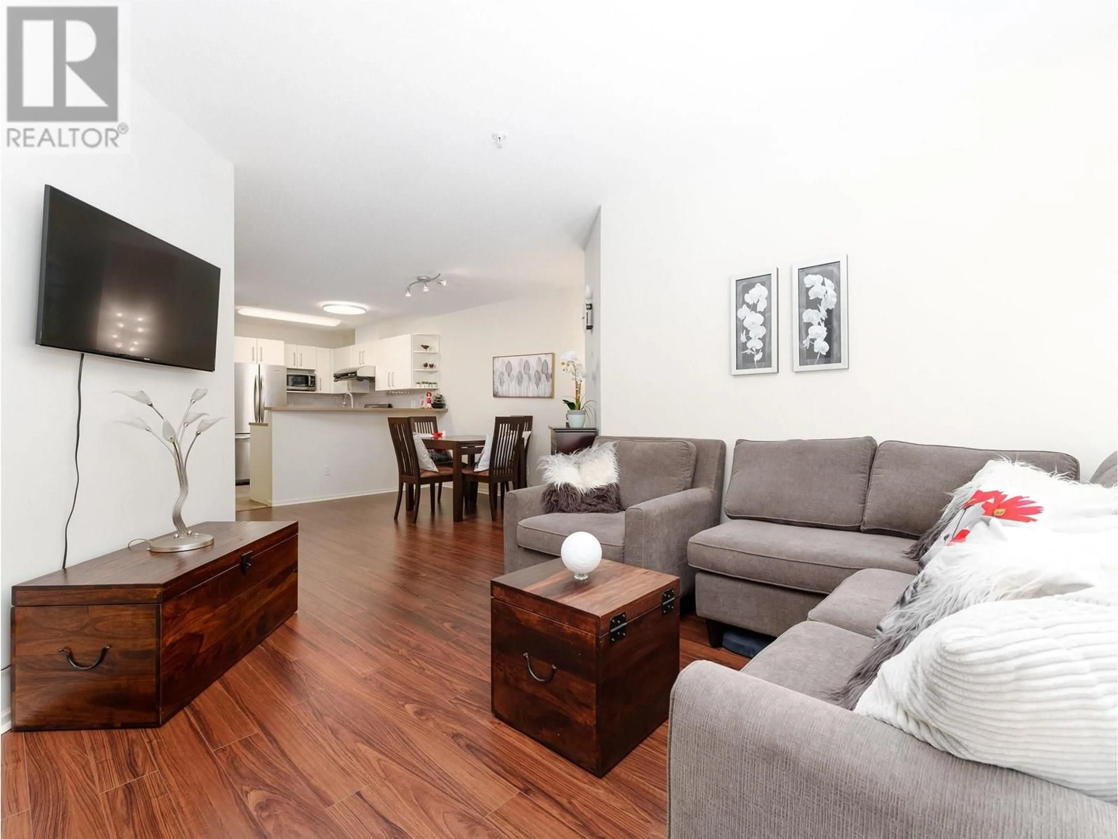 Living room with furniture, wood/laminate floor for 308 - 7330 SALISBURY AVENUE, Burnaby British Columbia V5E4N8
