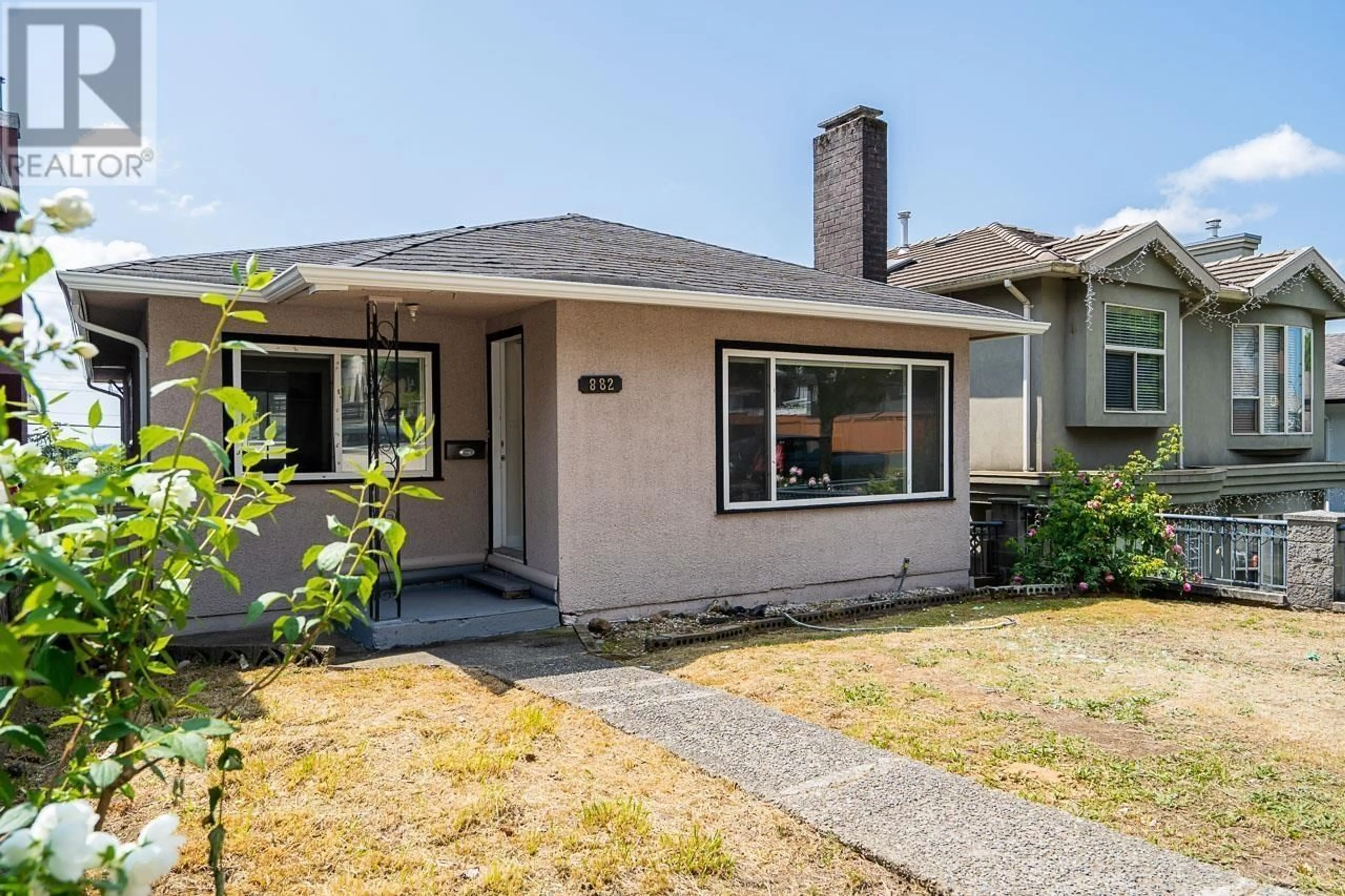 Home with vinyl exterior material, street for 882 63RD AVENUE, Vancouver British Columbia V5X2K8