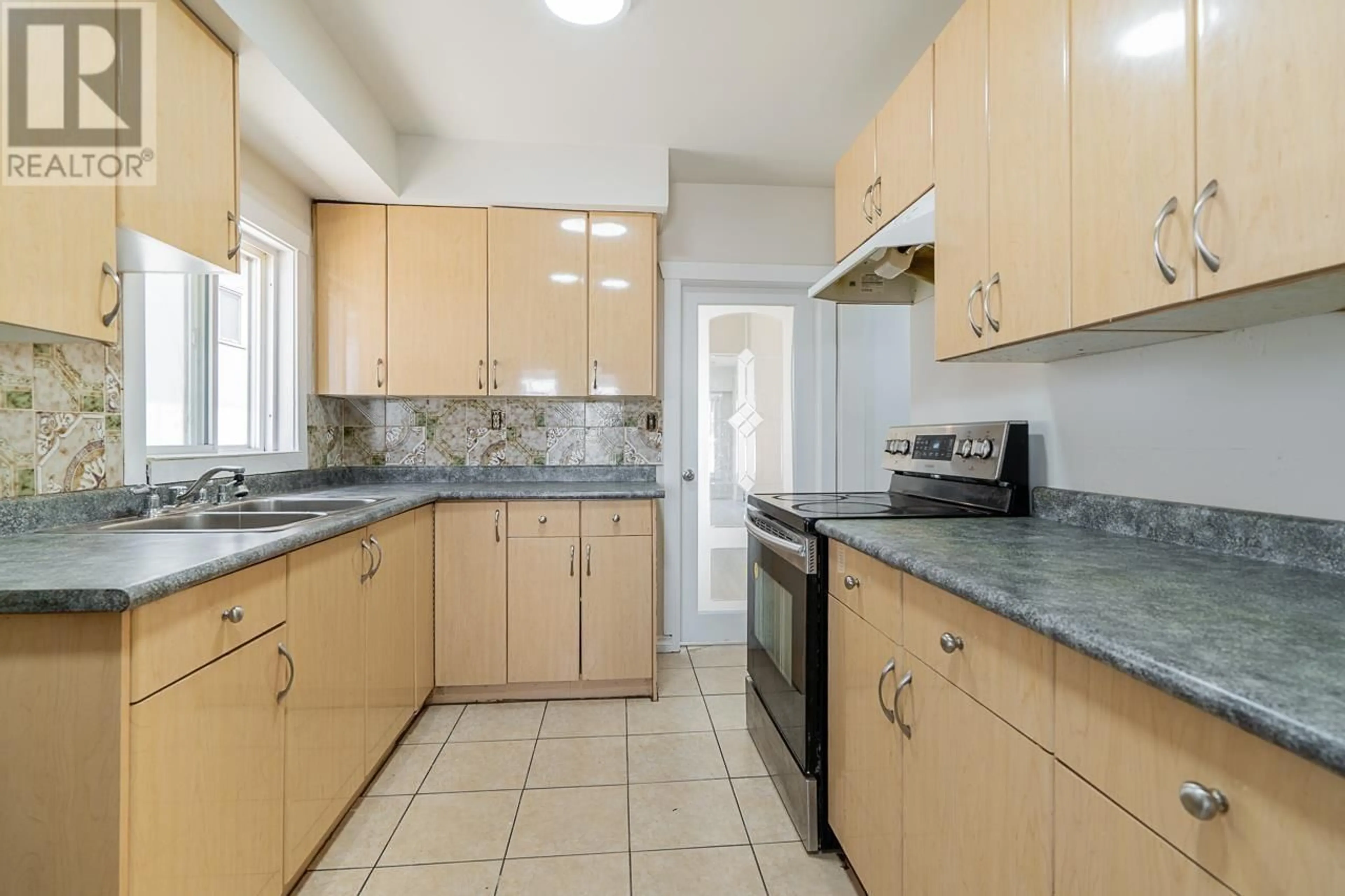 Standard kitchen, ceramic/tile floor for 882 63RD AVENUE, Vancouver British Columbia V5X2K8