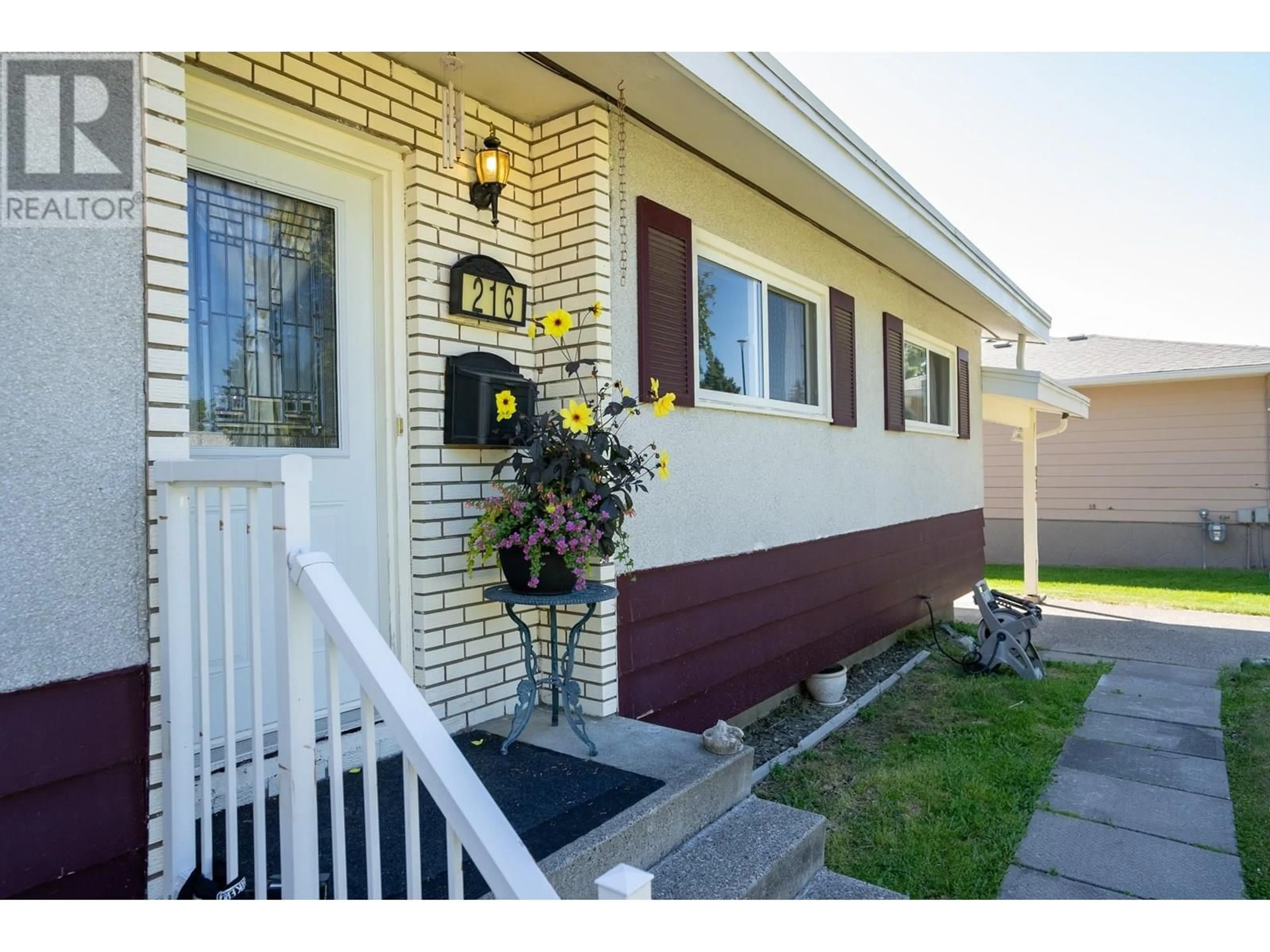 Home with vinyl exterior material, street for 216 PORTAGE STREET, Prince George British Columbia V2M4N4