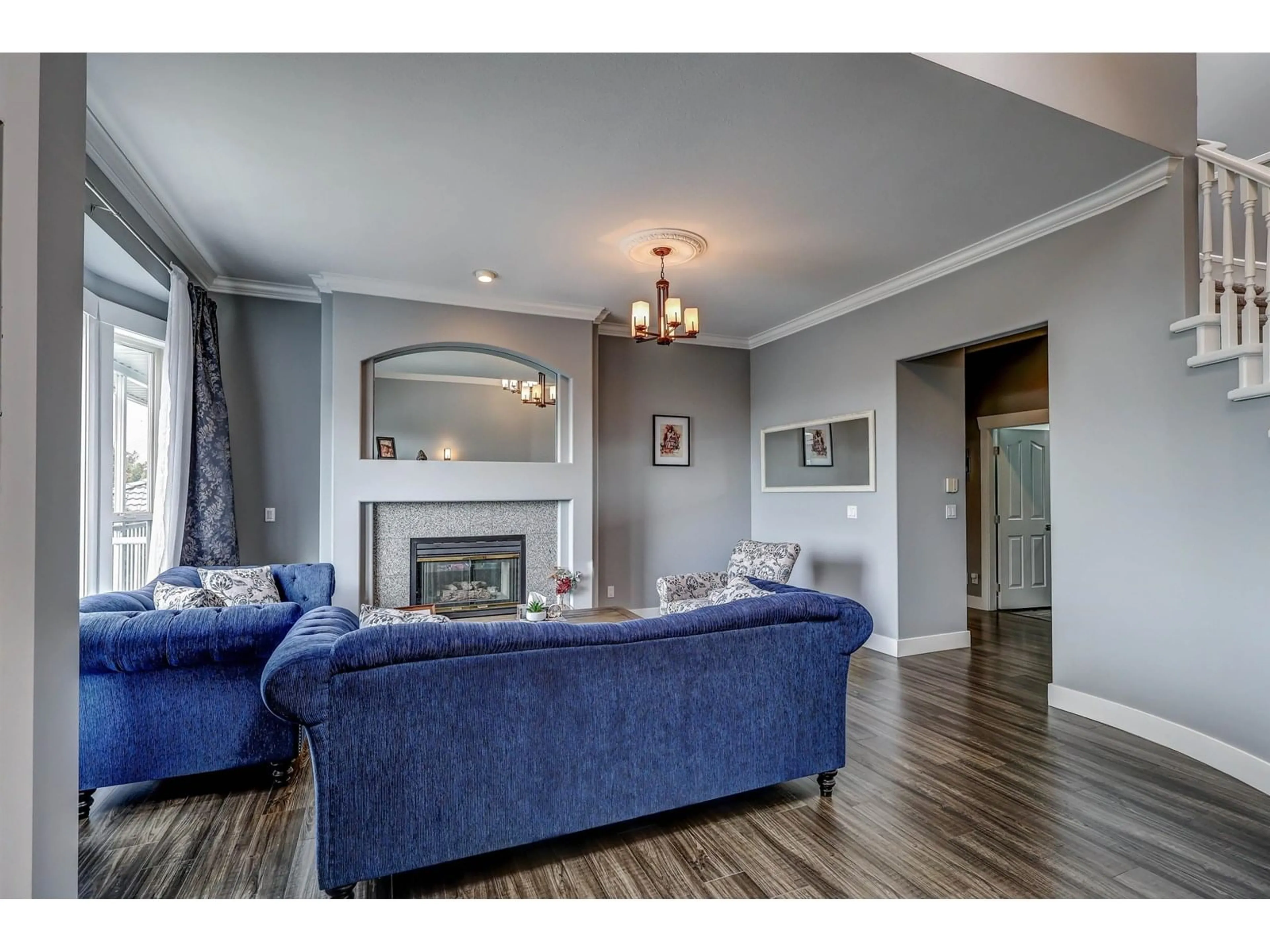 Living room with furniture, wood/laminate floor for 8222 NECHAKO, Delta British Columbia V4C3X3