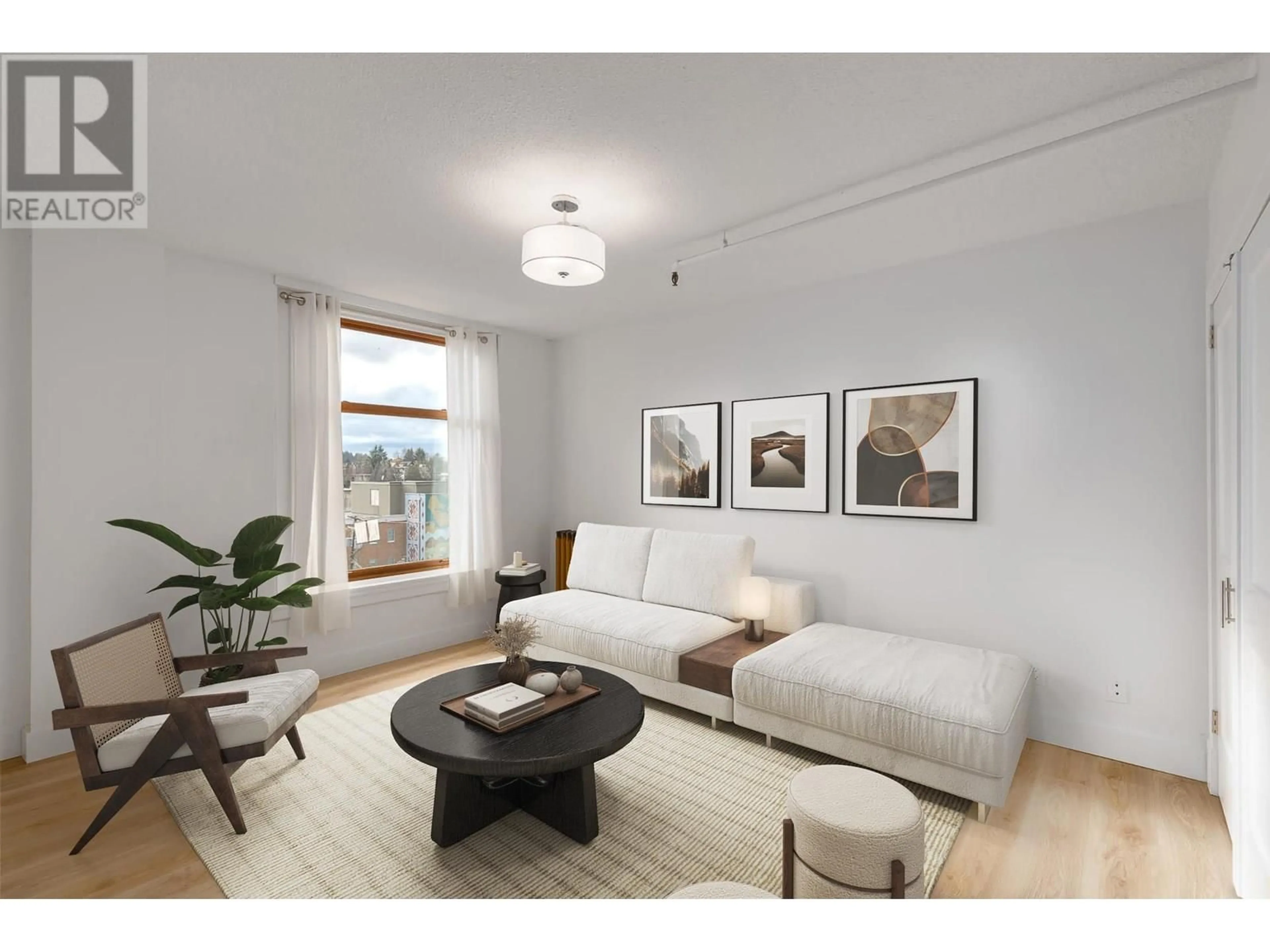 Living room with furniture, wood/laminate floor for 406 - 175 BROADWAY, Vancouver British Columbia V5T1W2